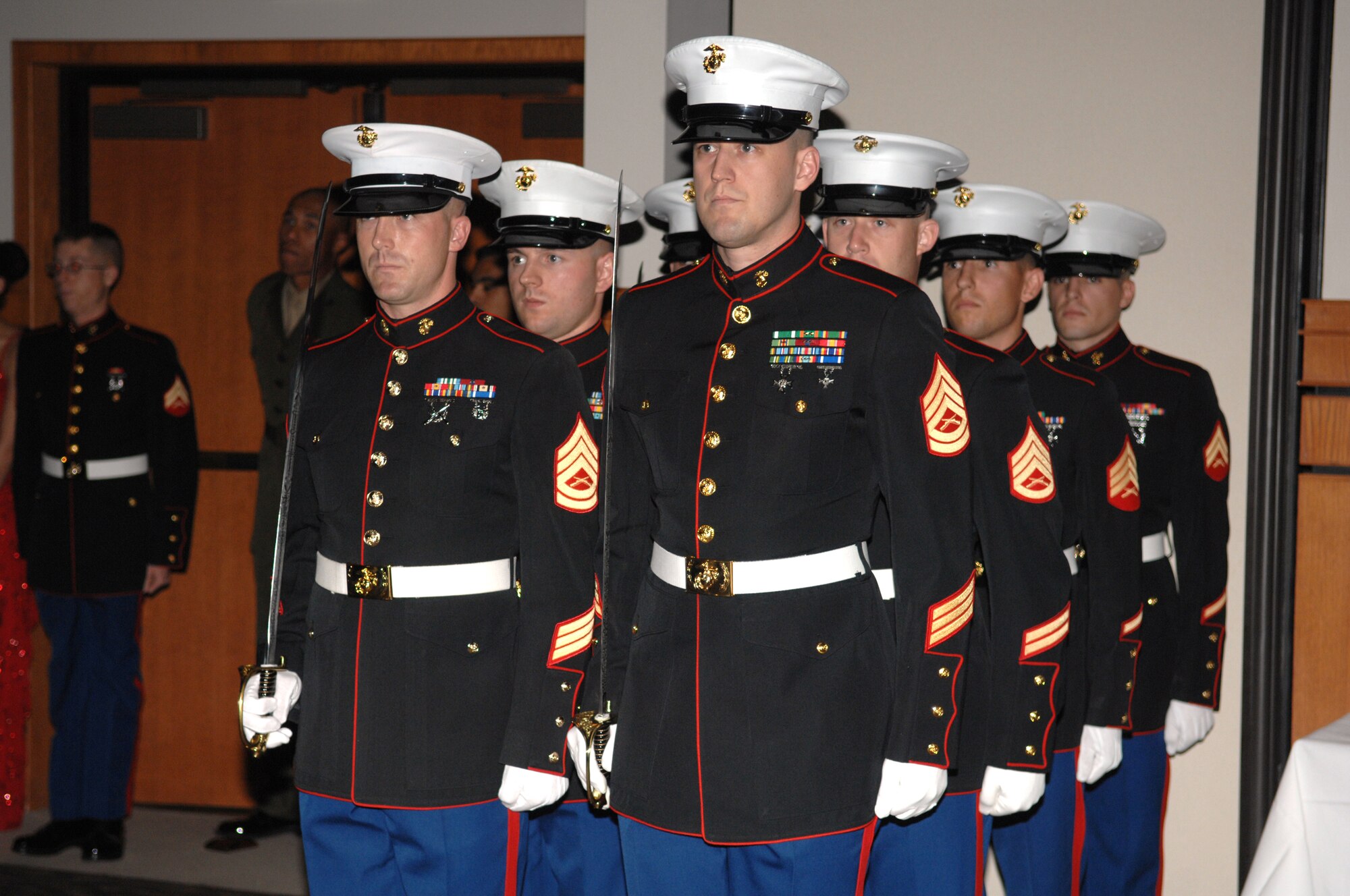 Marching to form an honor guard at the 2008 Marine Corps Ball Nov. 1 are (in no particular order) Gunnery Sgt. Jonathan French, Marine Staff Sgt. Kenneth Aldredge, Marine Sgt. Raymond Richards, Marine Cpl. Donald Lader, Gunnery Sgt. Jerome Krejcha and Marine Staff Sgt Jason Charboneau. (U.S. Air Force photo by Tech. Sgt. John Barton)