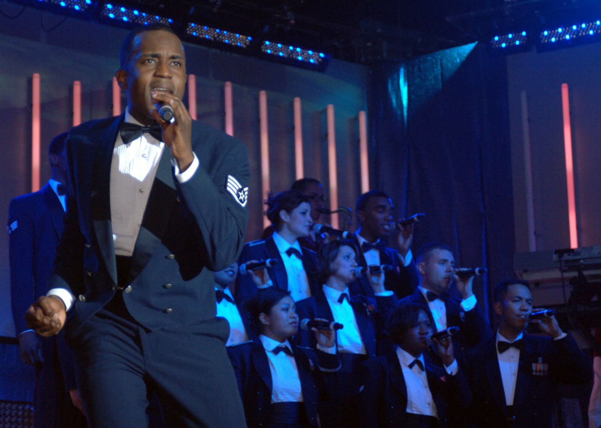 Staff Sgt. Corey Sims, a Computer Systems Analyst from Luke AFB, Ariz., and Tops in Blue 2008 vocalist, leads the closing act of “Déjà Blue” Nov. 3 at the Mississippi University for Women. (U.S. Air Force photo by Airman Josh Harbin)