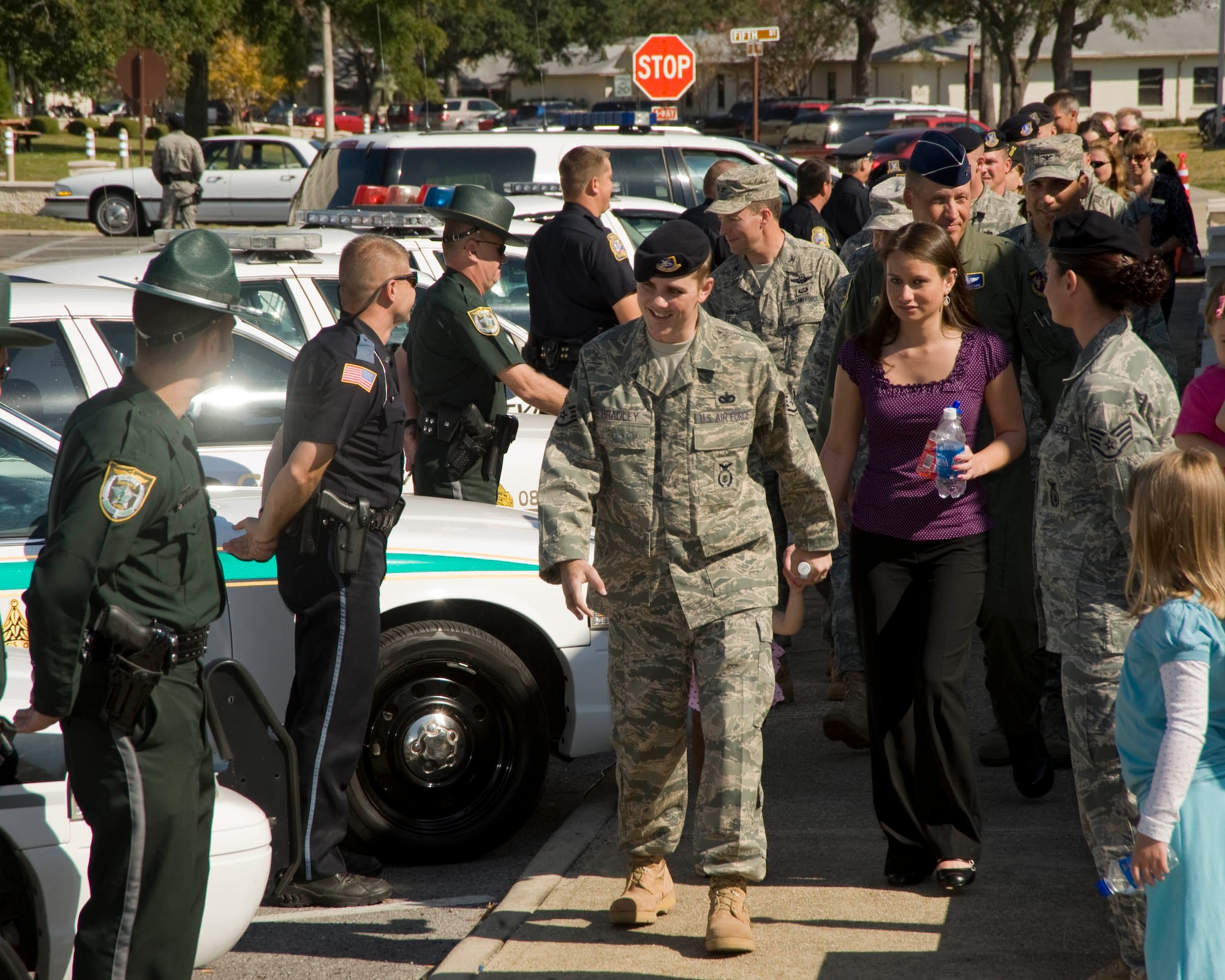 Staff Sgt. Nicholas Bradley, his wife Chantel and daughter Khaila, arrive at the 96th Security Forces Building. The Squadron hosted a welcome home for Sergeant Bradley who was seriously injured when an improvised explosive device exploded near his vehicle as he was serving with a convoy traveling in Afghanistan. (USAF photo/Craig McDonnell)