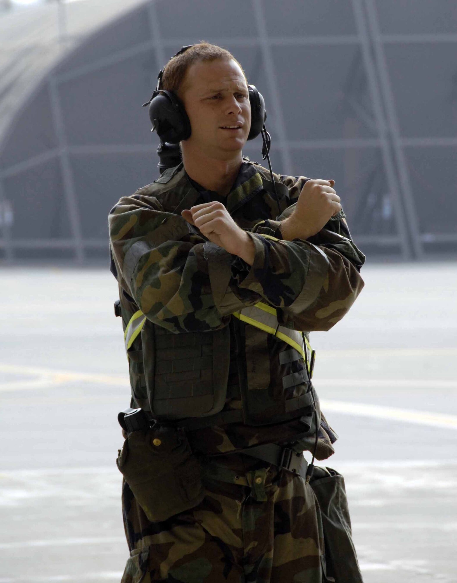 OSAN AIR BASE, Republic of Korea -- Staff Sgt. George Pastere, 25th Aircraft Maintenance Unit crew chief, recovers a “contaminated” A-10 Thunderbolt, during Exercise Beverly Bulldog 08-04 Nov. 6. The week-long exercise tests Team Osan’s readiness and ability to execute combat operations, receive follow-on forces and defend the base from attack. (U.S. Air Force/Staff Sgt. Lakisha Croley)