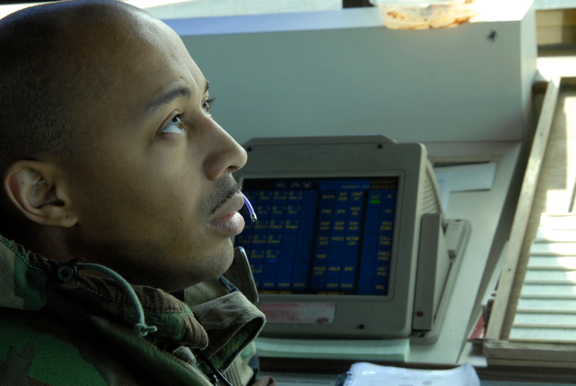 Staff Sgt. Gerald "GD" DeNore, Air Traffic Control watch supervisor, tracks aircraft in the airspace around Kunsan Air Base, Republic of Korea during the Peninsula-Wide Operational Readiness Exercise, Nov. 5, 2008. Kunsan is participating in the PENORE as a test of its wartime capabilities and response actions (U.S. Air Force Photo by SSgt Jason Colbert)