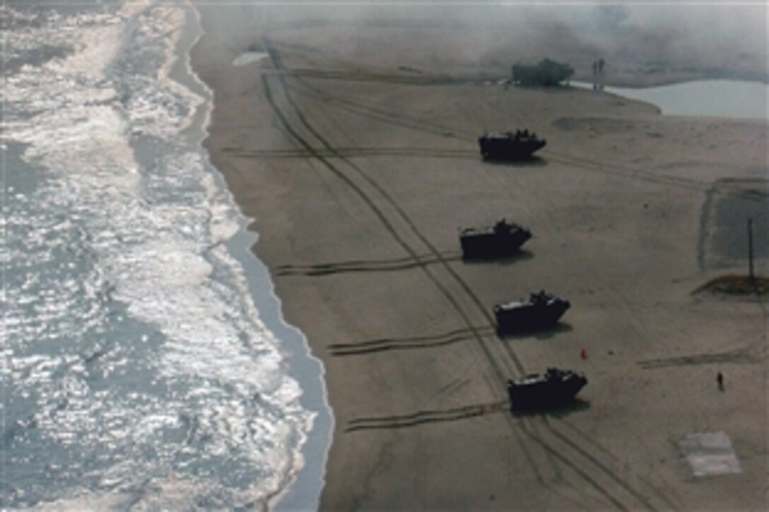 Amphibious assault vehicles from a battalion landing team with Lima Company, 3rd Battalion, 1st Marine Regiment, 31st Marine Expeditionary Unit, III Marine Expeditionary Force, conduct an amphibious landing rehearsal from USS Denver during Korean Incremental Training Program '09 in Pohang, South Korea, Nov. 5, 2008. The amphibious landing was conducted to provide Republic of Korea military with the sustained capability to respond to future contingencies from ship to shore.
