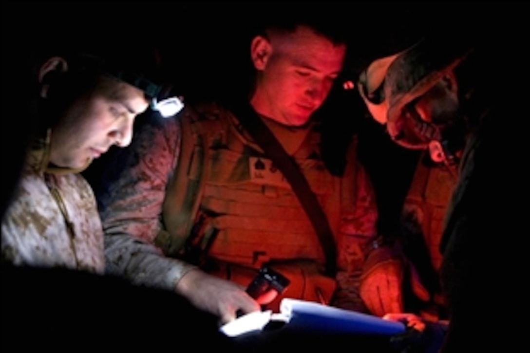 U.S. Marine Sgt. Charlie Peek reviews the passenger flight manifest roster, at Camp Fallujah, Iraq, Nov. 2, 2008. The Marines are assigned to the 1st Battalion, 3rd Marine Regiment, Regimental Combat Team 1. The Marines and Iraqi Security Forces were conducting a joint operation in their area of responsibility.