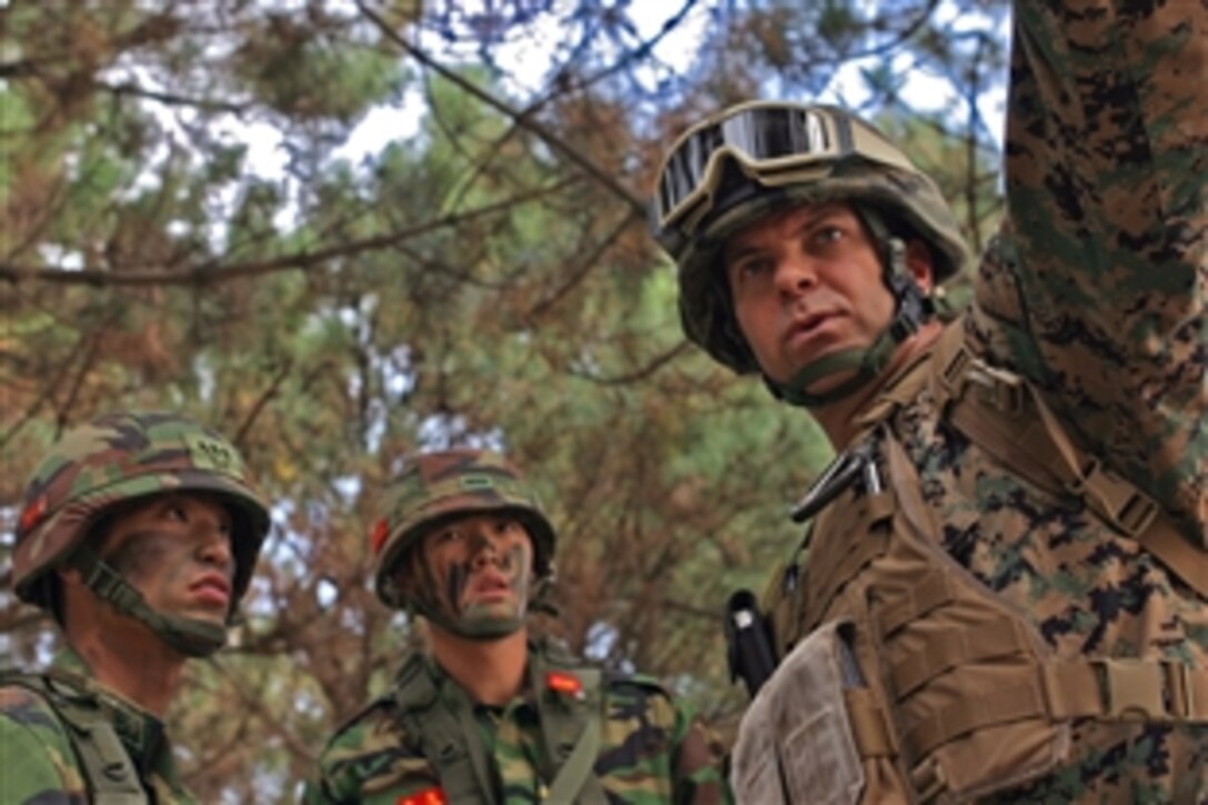 U.S. Marine Maj. Scott Packard directs two Republic of Korea marines during an amphibious training exercise in Pohang, Republic of Korea, Nov. 6, 2008. The exercise is an annual training event for Korean and U.S. forces.