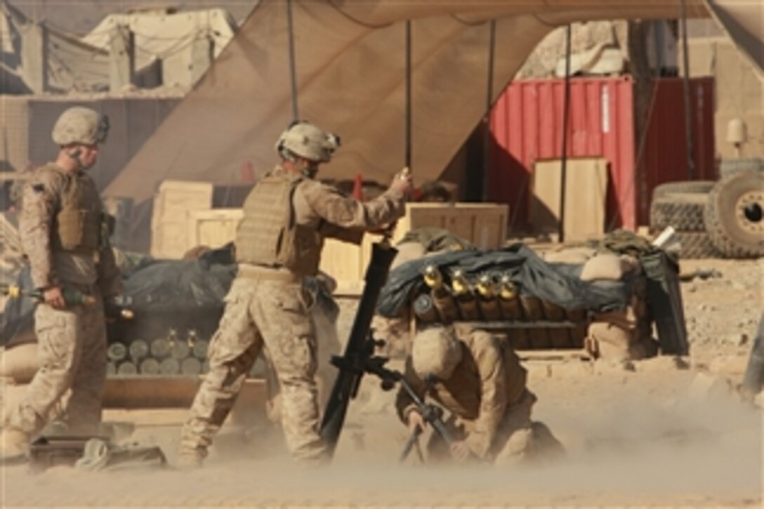 U.S. Marines attached to Foxtrot Company, 2nd Battalion, 7th Marine Regiment fire mortars at enemy targets from Forward Operating Base Now Zad in the Helmand province of Afghanistan on Oct. 26, 2008.  The Marines are assigned to a reinforced light infantry battalion.  