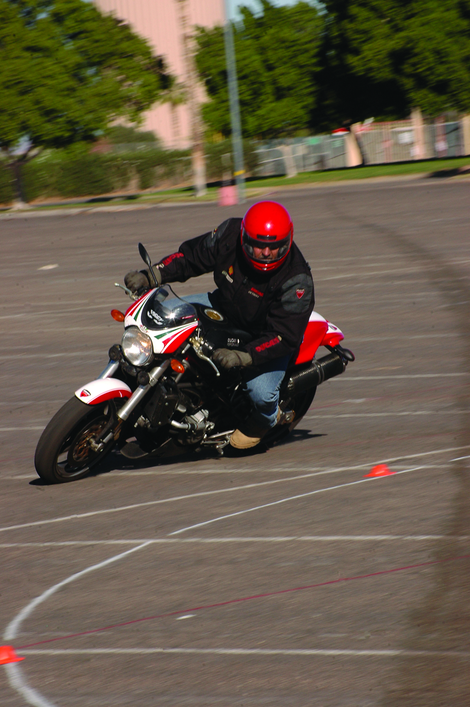 Paul Lasco, station sport bike course instructor, drives through the former course training track at the Yuma Civic Center parking lot in Yuma, Ariz., Nov. 6, 2008. Marine Corps Air Station Yuma safety courses were held at the civic center prior to the construction of a new track on base. The track was completed July 1, 2009.