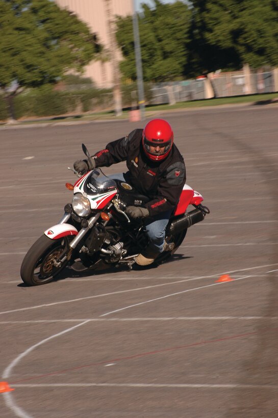 Paul Lasco, station sport bike course instructor, drives through the former course training track at the Yuma Civic Center parking lot in Yuma, Ariz., Nov. 6, 2008. Marine Corps Air Station Yuma safety courses were held at the civic center prior to the construction of a new track on base. The track was completed July 1, 2009.