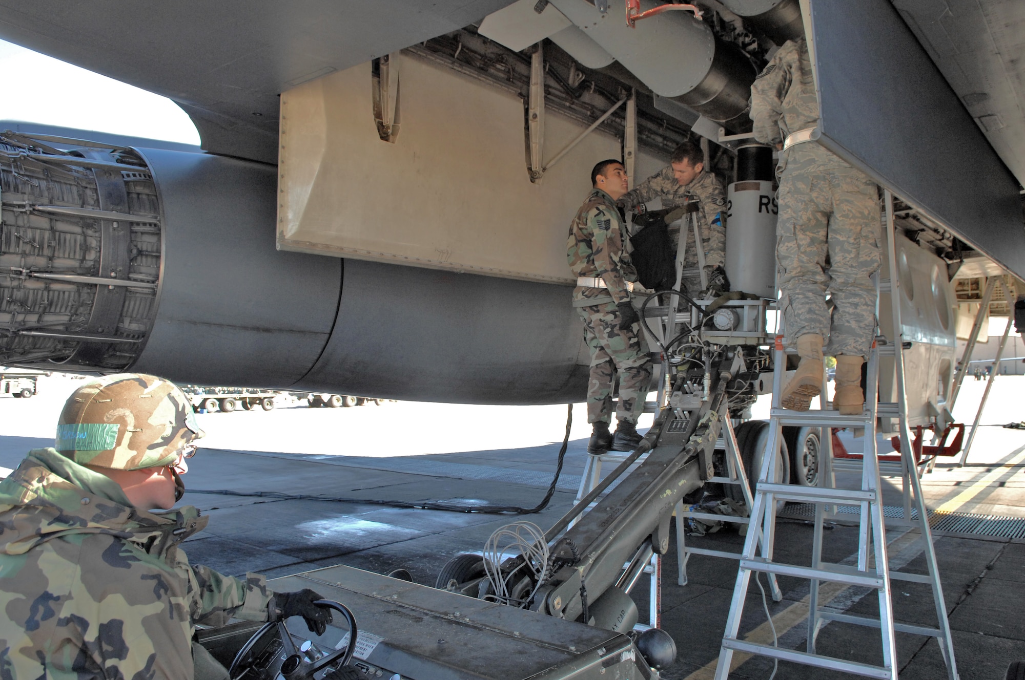 DYESS AIR FORCE BASE, Texas -- A group of Airmen from the 7th Maintenance Operations and 7th Aircraft Maintenance Squadrons ensure a bomb is put correctly under a B-1 bomber during an Operation Readiness Exercise here Nov. 7. The exercise times how well Airmen work together as a team & how fast they can get a plane ready for deployment.  This exercise will also help prepare Airmen for real world missions and the upcoming Operation Readiness Inspection when the base will be looked at on its effectiveness in performing a wartime, contingency, force sustainment and operational mission.  (U.S. Air Force photo/Staff Sgt Connor Estes)  