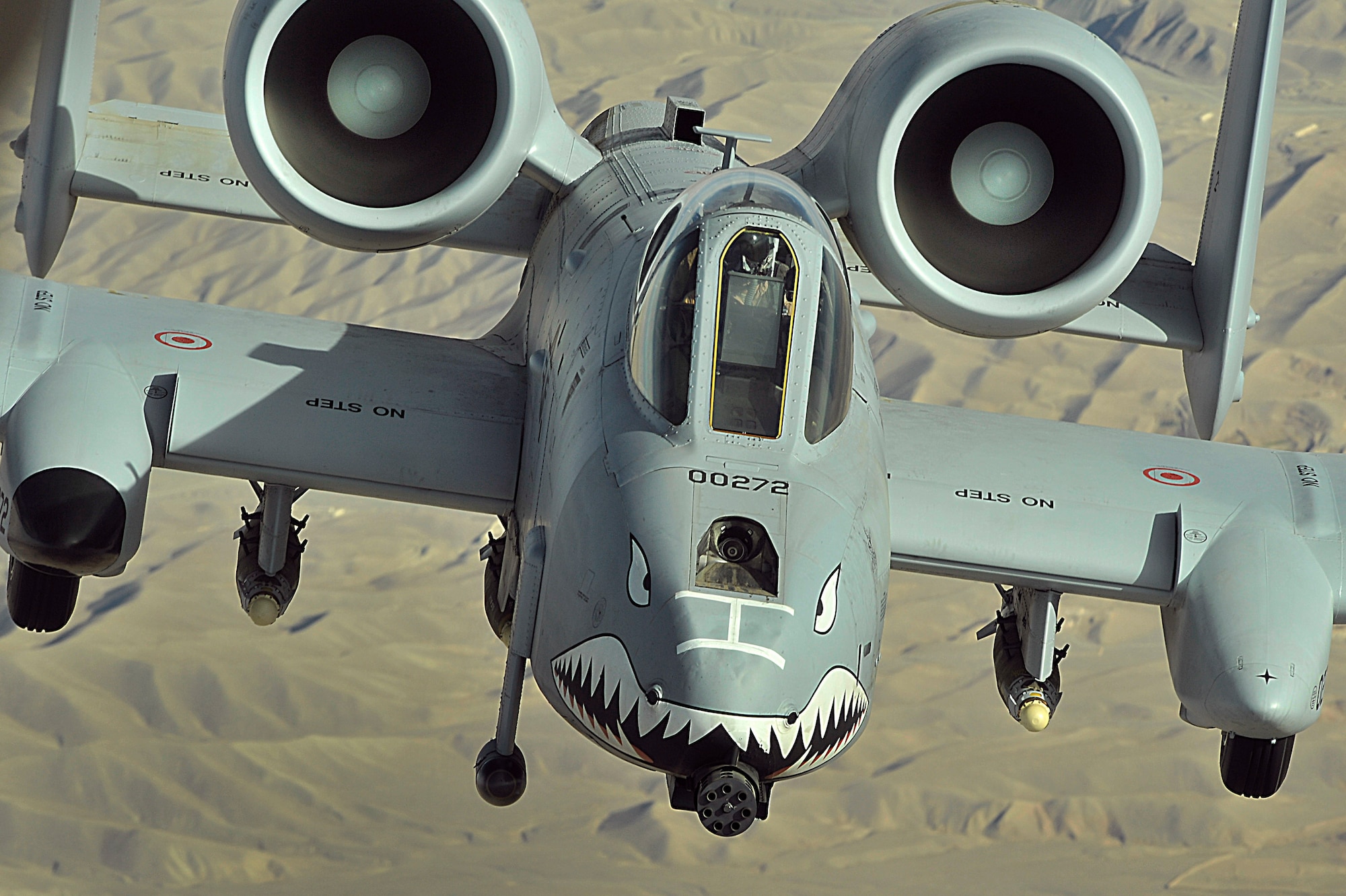 An A-10 Thunderbolt II flies a close-air-support mission over Afghanistan on Nov. 7. The A-10 has excellent maneuverability at low air speeds and altitude, and are highly accurate weapons-delivery platforms. The first production A-10A was delivered to Davis-Monthan Air Force Base, Ariz., in October 1975. It was designed specially for the close-air-support mission and had the ability to combine large military loads, long loiter and wide combat radius, which proved to be vital assets to the United States and its allies during Operation Desert Storm and Operation Noble Anvil. (U.S. Air Force photo/Staff Sgt. Aaron Allmon)