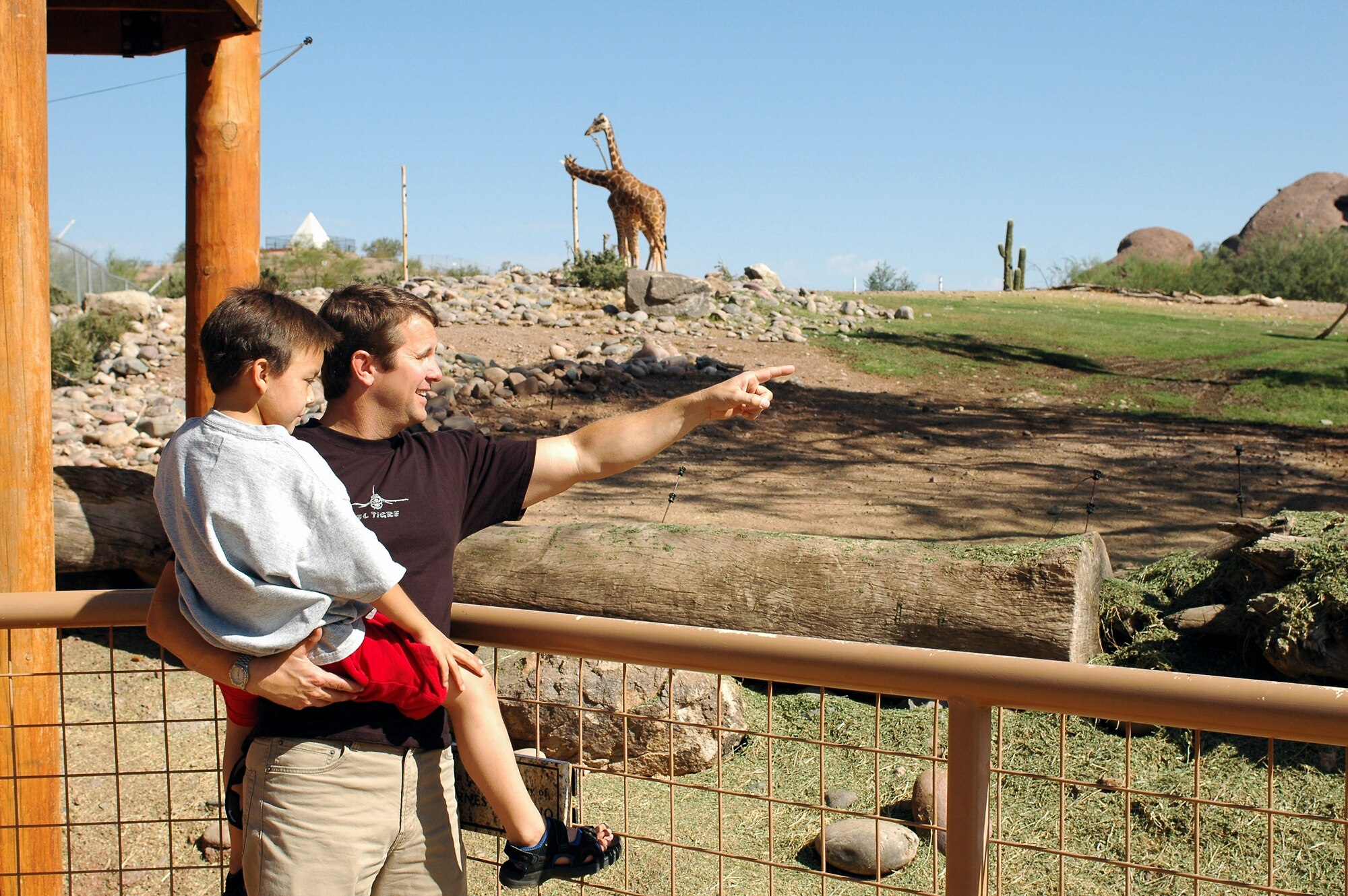 Dominic Magne and Lt. Col. Scott Reinhold enjoy a day at the Phoenix Zoo, Oct. 30. The second-grader and the F-16 pilot have remained friends since Dominic visited the 162nd Fighter Wing in Tucson, Ariz., last year to fulfill his dream to become a fighter pilot. (U.S. Air Force photo/ Capt. Gabe Johnson)

