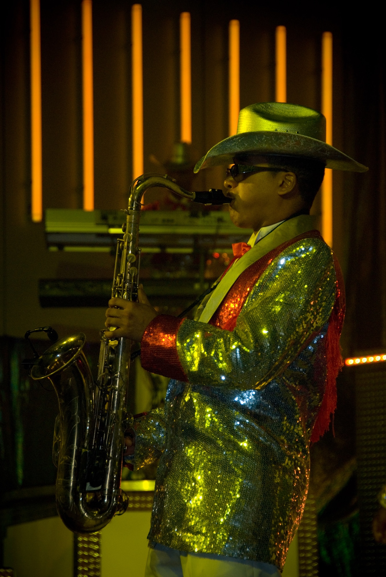 Airman 1st Class Jesse Hernandez-Lora rocks out on his tenor sax to "Life is a Highway" during the 2008 Tops in Blue tour, which performed for a near-capacity crowd Sunday at the Davis Theater. (Air Force photo by Jamie Pitcher)