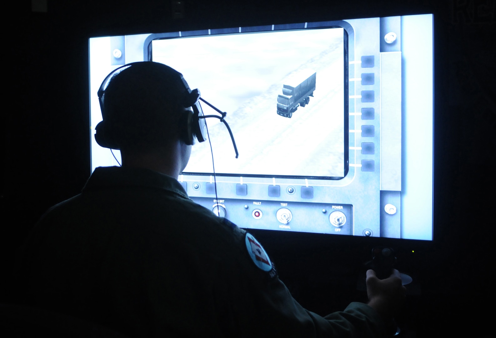 Capt. Sam Allen, 563rd Flying Training Squadron instructor and Unmanned Aerial Systems Unmanned Flight Course director, operates the controls of a battlespace simulator in the course's laboratory. The four-week UFC course begins Nov. 21. (U.S. Air Force photo by Rich McFadden) 