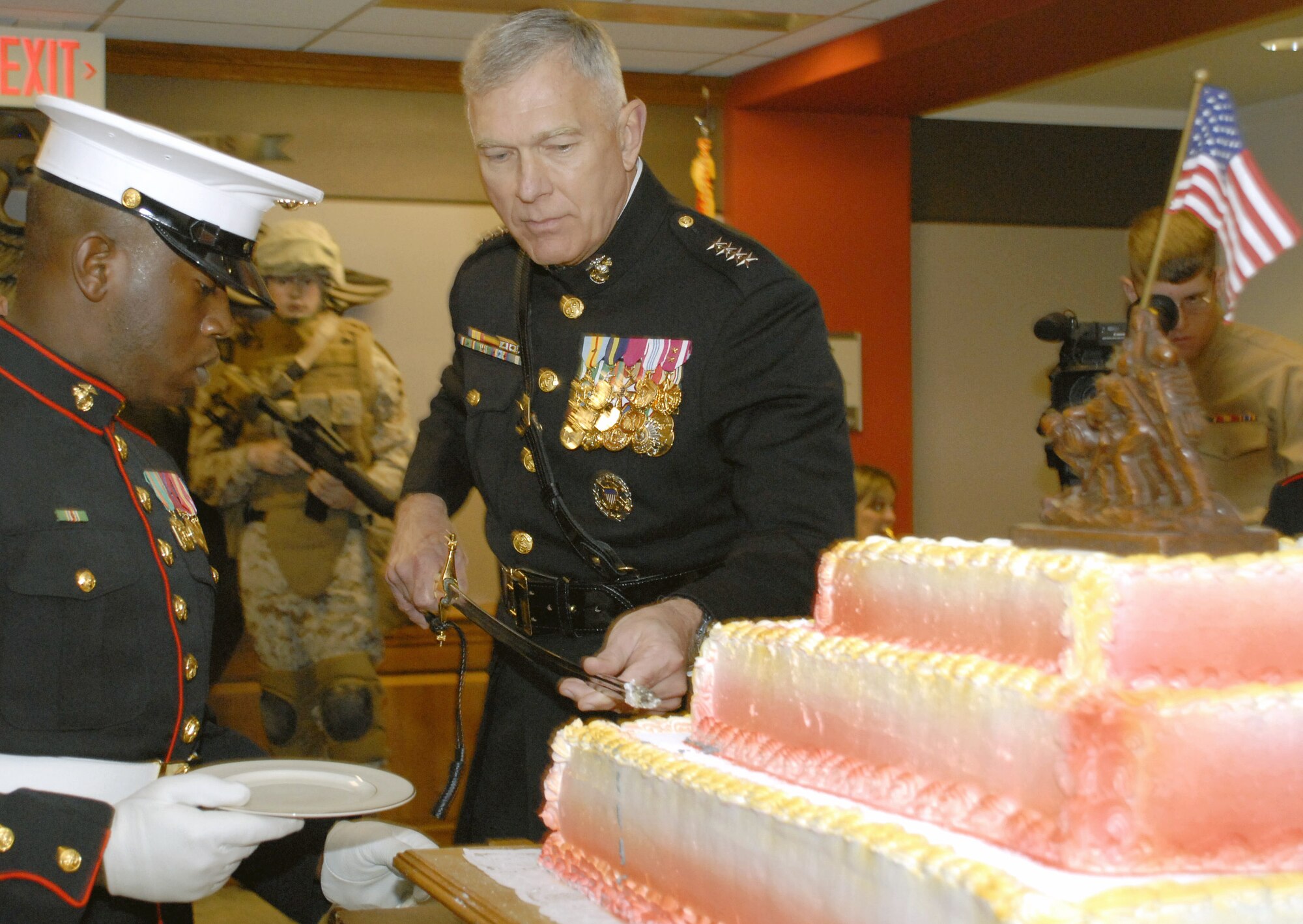 Gen. James T. Conway, commandant of the Marine Corps, uses a traditional saber to cut the Marine Corps birthday cake.  The Corps celebrates its 233rd birthday with a celebration Nov. 7 in the newly-opened Marine Corps Corridor in the Pentagon. Guests included more than 100 Marines, Sailors, civilians and other members of the joint staff as well as and Secretary of the Navy Donald C. Winter. The Marine Corps was founded on Nov. 10, 1775.  (Air Force photo/Staff Sgt. J.G. Buzanowski)