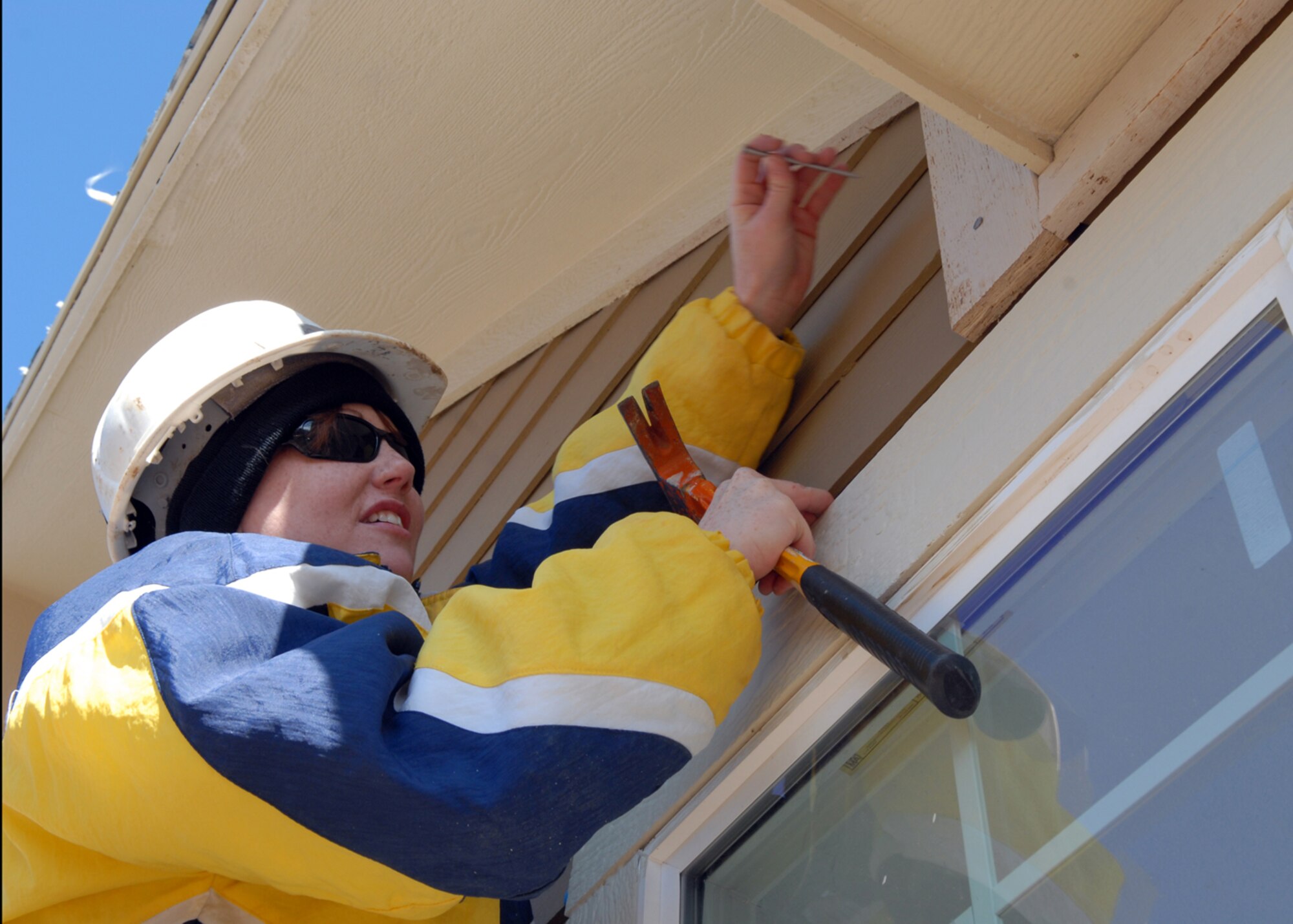 AURORA, Colo. -- Special Agent Angela Miles, of Detachment 801 from the Buckley Office of Special Investigations, helps to construct a house while volunteering with other members of her detachment for Habitat for Humanity of Colorado, on Oct. 22. (U.S. Air Force photo by Airman 1st Class John Easterling)