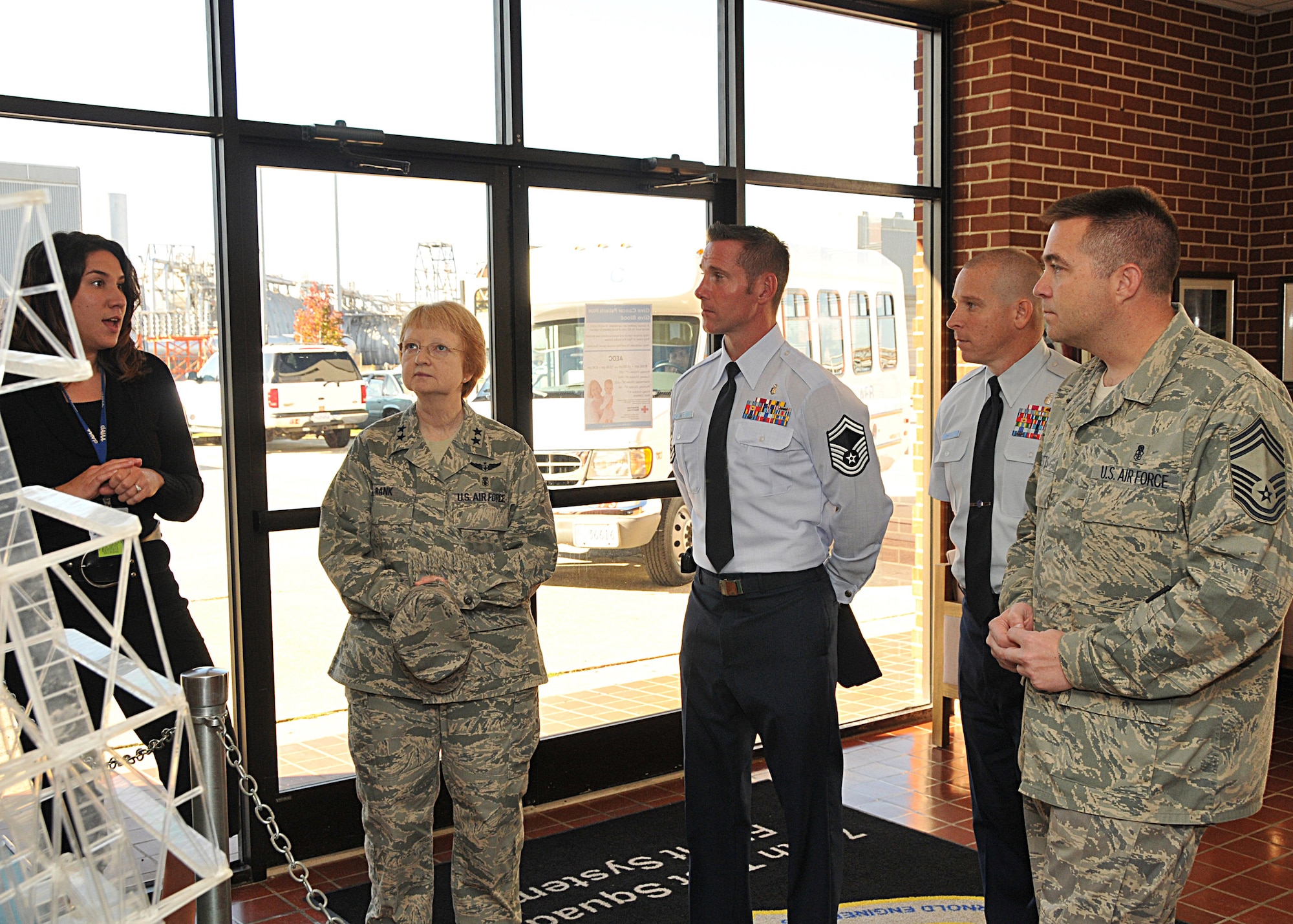 Left, Aerospace Testing Alliance Tour Coordinator Stephanie Warren explains the Propulsion Wind Tunnel facility to Maj. Gen. Melissa Rank during her visit. Chief Master Sgt. Joseph Potts, far right, accompanied the general on her visit. Center, Superintendent of the Arnold Medical Aid Station Senior Master Sgt. Karl Day and Non-Commissioned Officer-in-Charge of Base Medical Services Master Sgt. Rob Louchery, behind right, also joined the tour. (Photo by David Housch)
