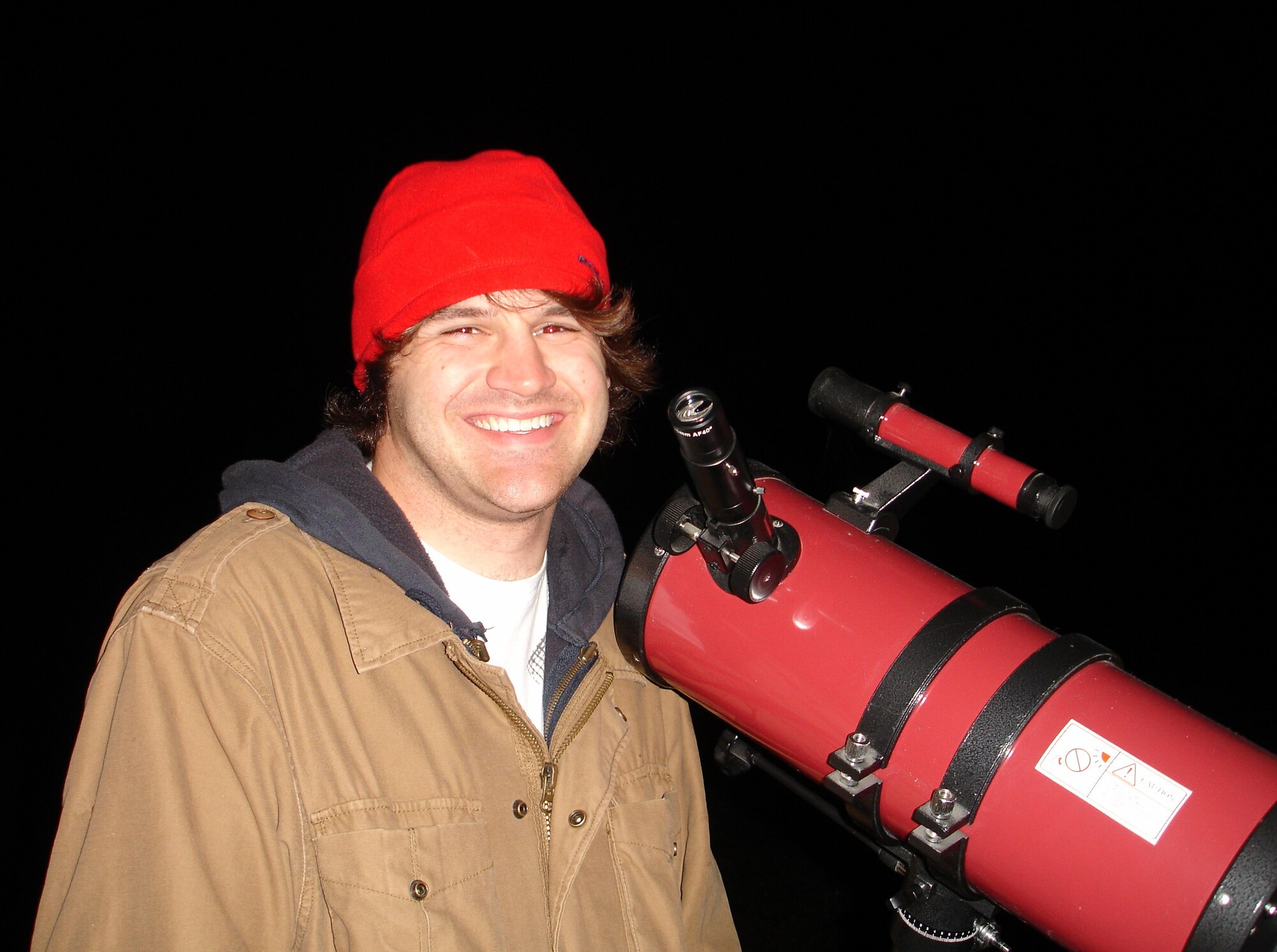 Gary Hammock, ATA engineering analyst, stands with his 150-millimeter diameter, 750-millimeter focal length reflector telescope on his parents farm in Westmoreland, Tenn. The most interesting images he says he’s seen is the blurry elliptical shape of the Andromeda galaxy and clearly seeing the rings of Saturn. (Photo provided)