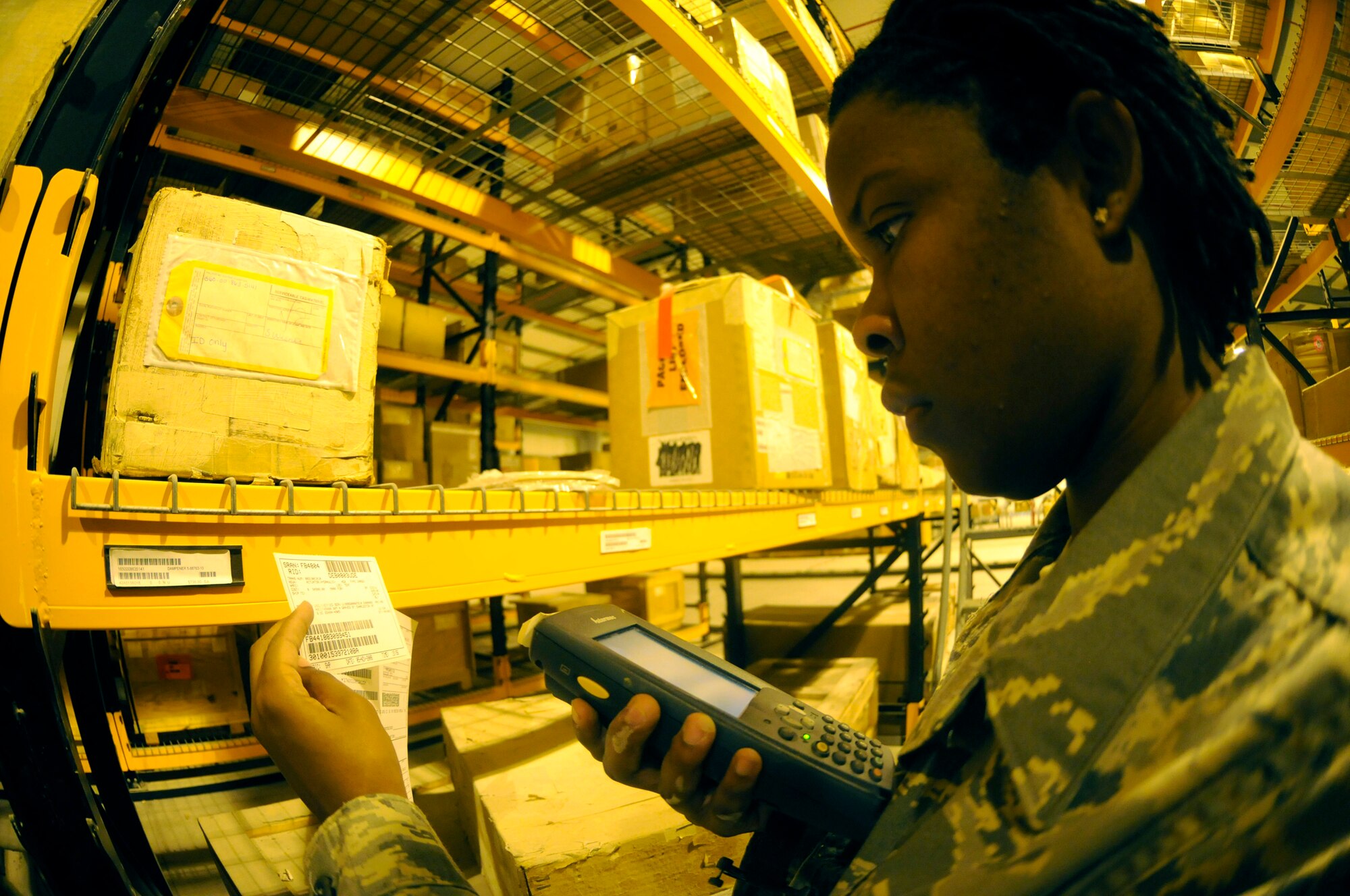 Senior Airmen Kendra Bossard, consolidated aircraft parts store journeyman assigned to the 379th Expeditionary Logistics Readiness Squadron, uses a supply asset tracking system gun to scan labels to maintain accountability of their inventory items Nov. 6, at an undisclosed air base in Southwest Asia.  Airman Bossard, a native of Sumter, S.C., is deployed from Langley Air Force Base, Va., in support of Operations Iraqi and Enduring Freedom and Joint Task Force-Horn of Africa. (U.S. Air Force photo by Staff Sgt. Darnell T. Cannady/Released)