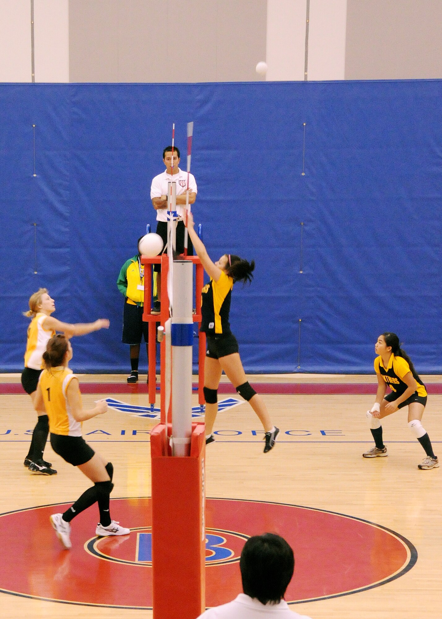ANDERSEN AIR FORCE BASE, Guam - Guam High School sophomore Tjaden Cornell leaps to block a shot delivered by Kadena High School senior Emily Tate during the 2008 Far East Girls’ Volleyball Tournament held here at the Coral Reef Fitness and Sports Center here Nov. 7. (U.S. Air Force photo by Airman 1st Class Nichelle Griffiths)
