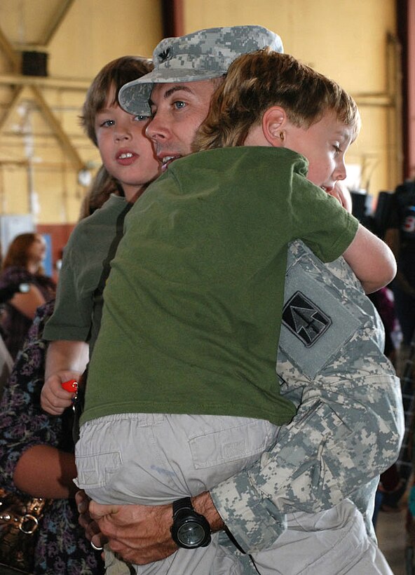 Kolton and Mason Newlin greet their father U.S. Army Col. Kenneth D. Newlin Nov. 5, 2008, upon his return from a nine-month deployment in Iraq with the 76th Infantry Brigade Combat Team.