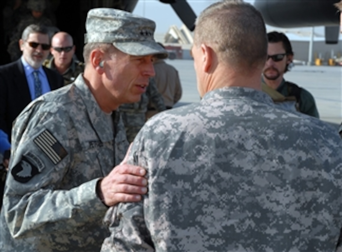 Commanding General of U.S. Central Command Gen. David Petraeus, U.S. Army, speaks with a soldier after arriving at Bagram Air Field, Afghanistan, on Nov. 6, 2008.  Petraeus will meet with senior U.S. and Afghan leaders as he assesses the situation in Afghanistan.  