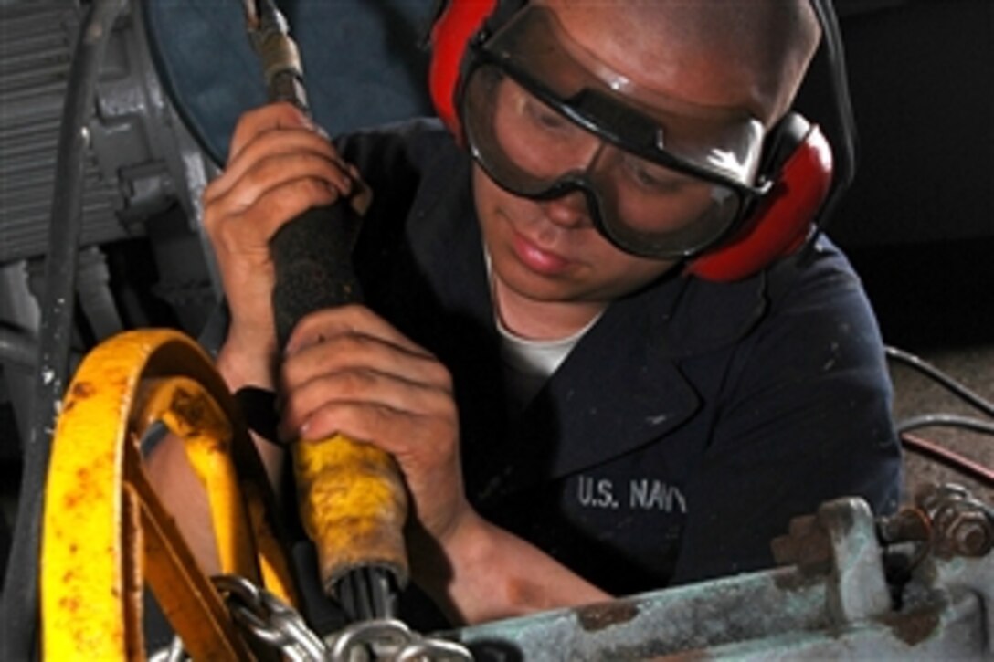 Seaman Apprentice Jacob Halfen performs corrosion preventative maintenance aboard the multi-purpose amphibious assault ship USS Iwo Jima in the Persian Gulf, Nov. 5, 2008. Iwo Jima is deployed as part of the Iwo Jima Expeditionary Strike Group supporting maritime security operations in the U.S. 5th Fleet area of responsibility.