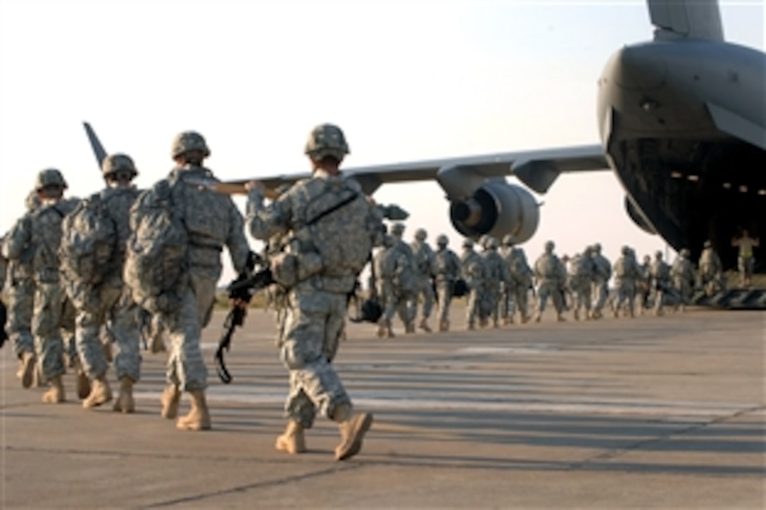 U.S. Army soldiers of the10th Mountain Division's 1st Brigade board a C-17 Globemaster III on Kirkuk Regional Air Base, Iraq, Nov. 4, 2008. The soldiers are heading back toward the United States after serving a 15-month deployment in Iraq.