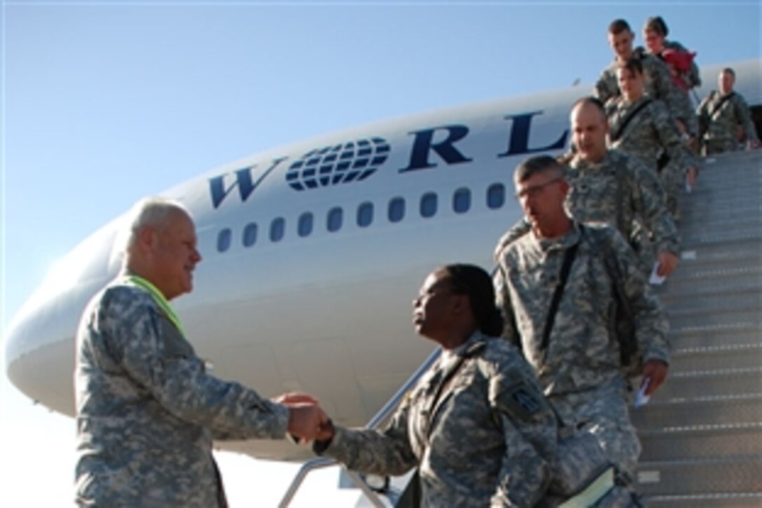 Army Maj. Gen. R. Martin Umbarger, Indiana National Guard adjutant general, greets Master Sgt. Karolyn Peeler upon her return from deployment to Iraq , Nov. 5, 2008. Peeler serves as the judge advocate general noncommissioned officer in charge with the Headquarters Company, 76th Infantry Brigade Combat Team. The brigade's Iraqi deployment marked the largest Indiana Guard deployment since World War II. 