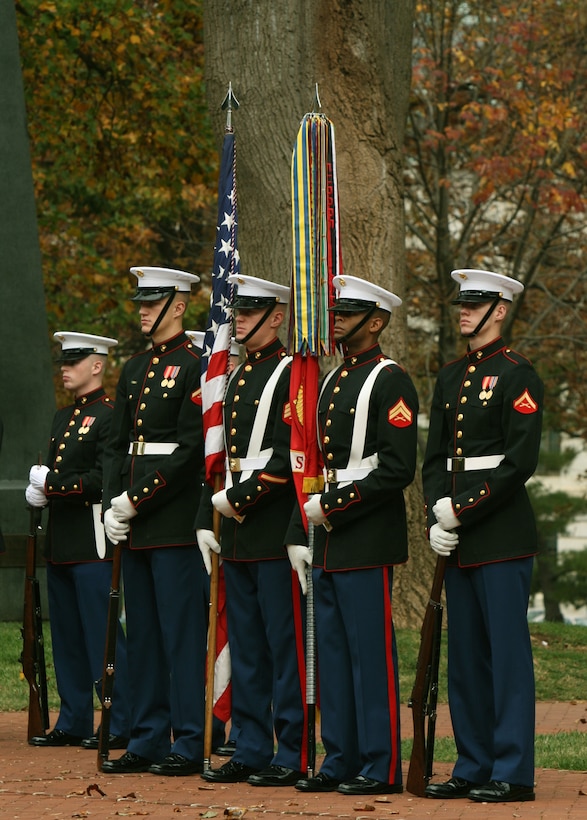 The Marine Corps Color Guard stands watch over the funeral of Col. John Ripley at the U.S. Naval Academy in Annapolis, Md., Nov 7. The Color Sergeant of the Marine Corps, Sgt. Scott A. Jewel, holds the national flag, while the Marine to his left carries the official Battle Colors of the Marine Corps.