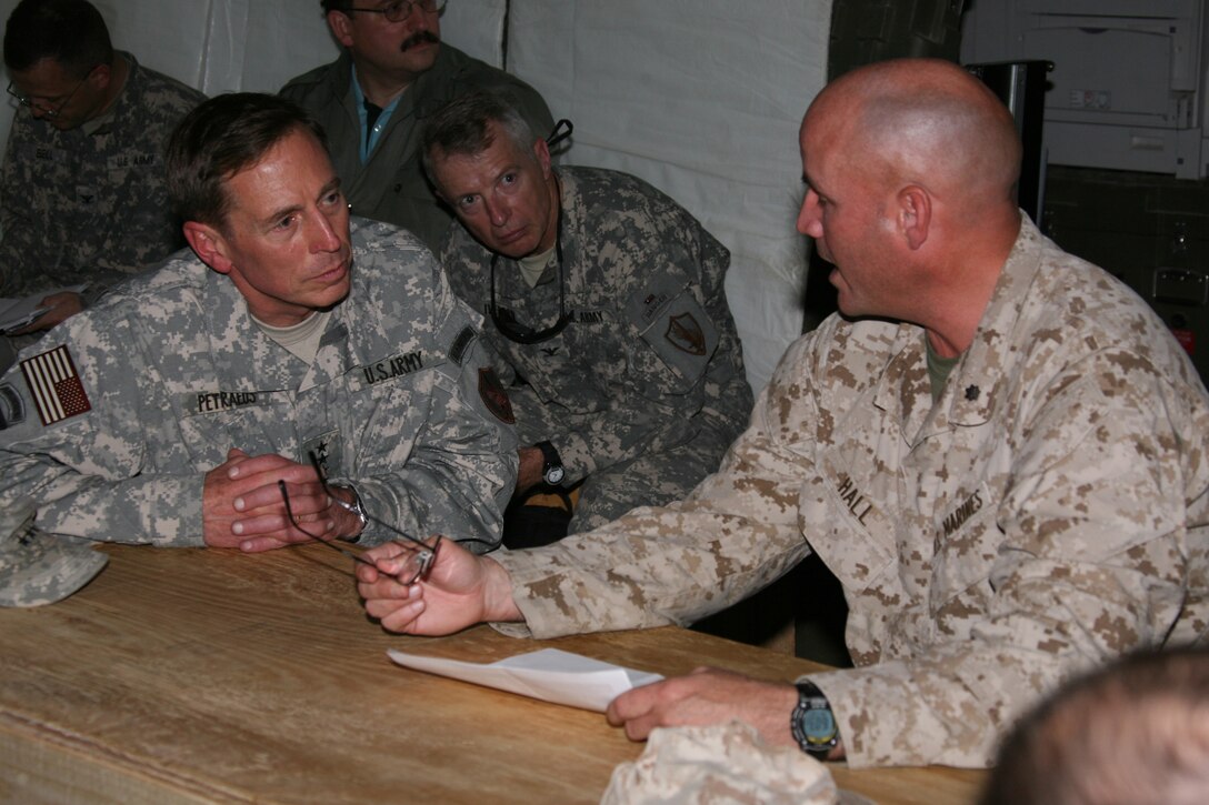 U.S. Army Gen. David H. Petraeus (left) listens to Lt. Col. Rick Hall, commander of Task Force 2d Battalion, 7th Marine Regiment, Special Purpose Marine Air Ground Task Force Afghanistan, as he briefs the CENTCOM commander on combat operations his Marines have carried out since deploying to Afghanistan in support of Operation Enduring Freedom.