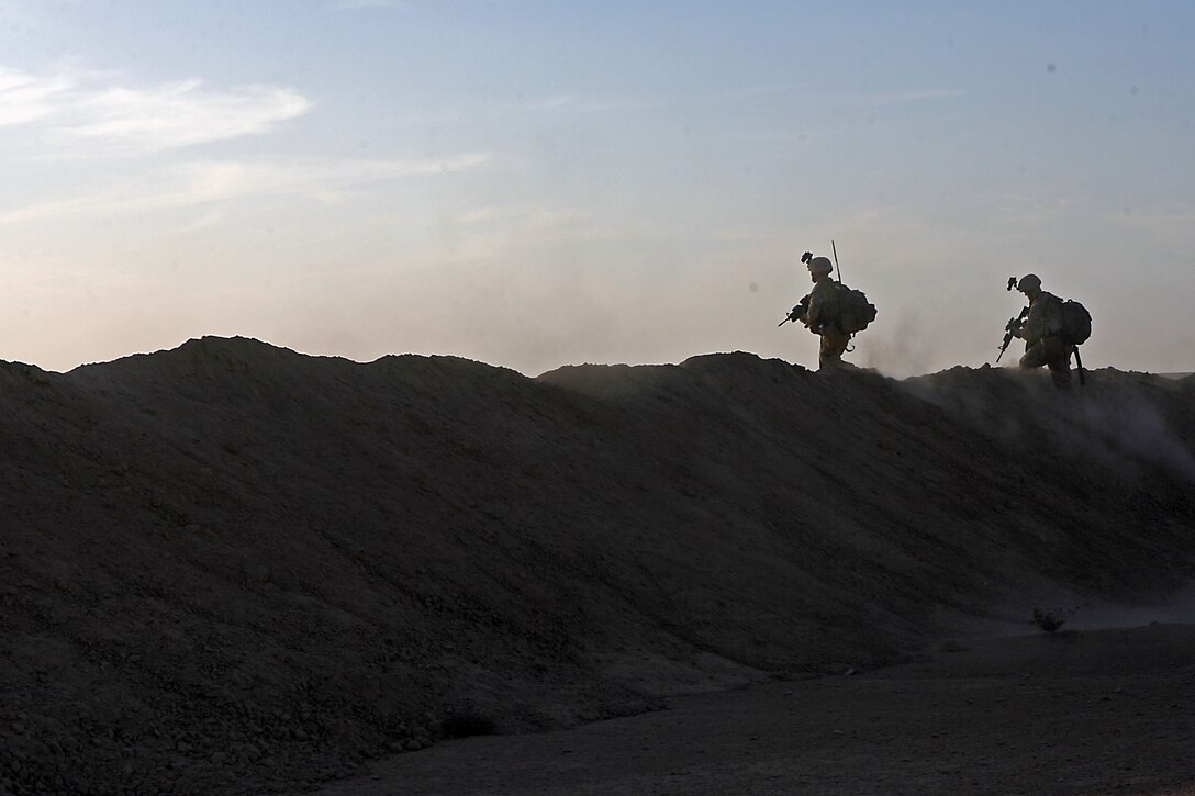 With one awkward step over the berm, the Marines of the Military Police detachment here began their first security and reconnaissance patrol in Iraq’s northern Nineweh Province Nov. 9. The MPs with Combat Logistics Company 19, 1st Marine Logistics Group, shoulder the task of base security here, which includes presence patrols through adjacent towns and abandoned structures. Their mission Nov. 9 was to clear out and secure an old, abandoned town located just a kilometer west of Camp Sinjar. As insurgent activity continues in Mosul, a city located East of Sinjar, Marine presence in smuggler jump off points and safe havens serves to choke off possible enemy supply routes. The MPs are just one part of the first Marine Air Ground Task Force outside Anbar in Iraq since 2004. They traveled to the Nineweh province to kick off Operation Defeat Al Qaeda in the North II, an operation aimed at stamping out the insurgency just west of the restive city of Mosul.