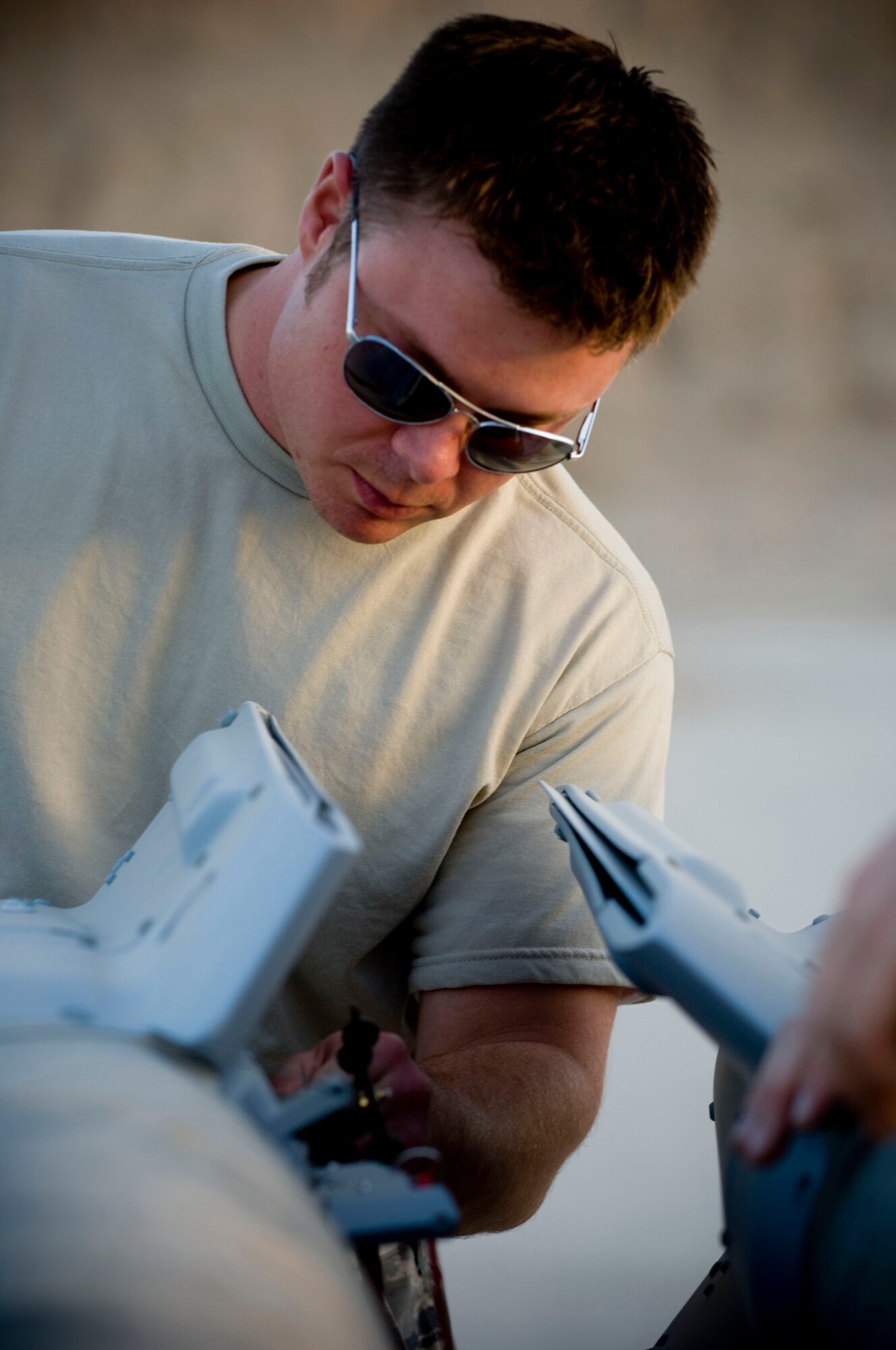 Staff Sgt. Aaron Ciccocioppo, 451st Air Expeditionary Group Logistics Flight-Ammo, inspects a GBU-12 laser-guided bomb at Kandahar Air Field, Afghanistan, Oct. 27, 2008. He is part of a three man team that makes sure the aircraft at Kandahar Air Field have the munitions they need, maintaining 100 percent accountability for those munitions. Sergeant Ciccocioppo is deployed from Langley Air Force Base, Va., and hails from Lancaster, Pa. (U.S. Air Force photo by Staff Sgt. Samuel Morse/Released)