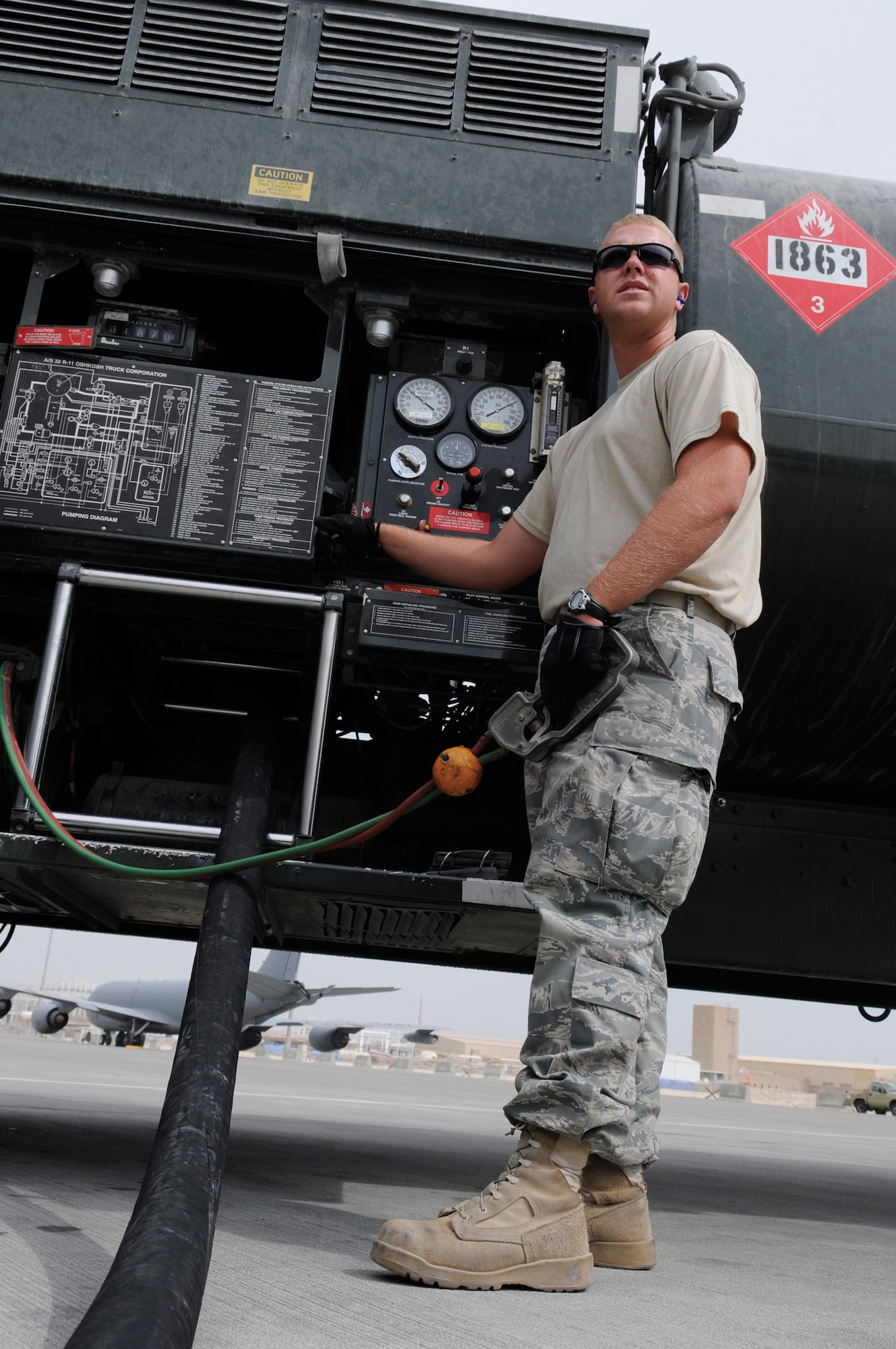 Airman 1st Class Bradley Dean, fuels apprentice assigned to the 379th Expeditionary Logistics Readiness Squadron, keeps a steady hand on the kill switch while fueling a KC-135 Stratotanker, Nov. 4, 2008, at an undisclosed air base in Southwest Asia. He keeps his attention on the crew chief of the aircraft and the gauges on his fuel truck. Depending on mission the KC-135 can hold four or five fuel trucks worth of fuel. Airman Dean is a native of Tennessee Colony, Texas, and deployed from Moody Air Force Base, Ga.  (U.S. Air Force photo by Tech. Sgt. Michael Boquette)