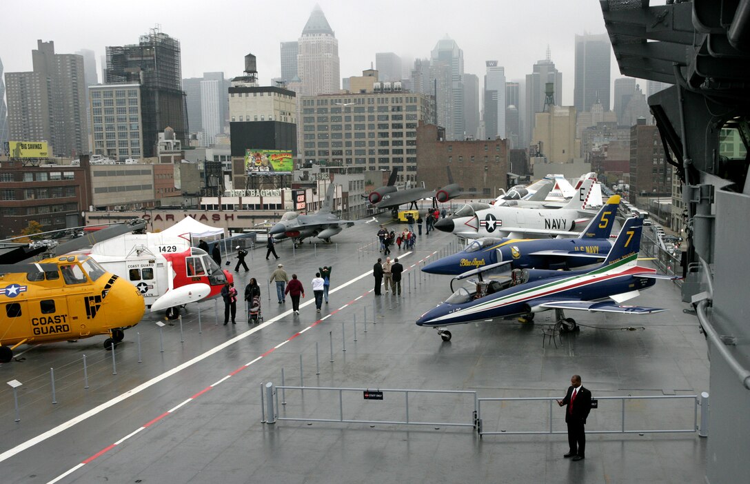 High atop the Intrepid Sea, Air and Space Museum, visitors view military aircraft after the re-opening of the museum Nov. 8, 2008, after being closed for two years. The museum was closed, dry-docked, refurbished and then returned to its original home at Pier 86 on the Hudson River in New York. Marines from the 22nd Marine Expeditionary Unit were in New York to provide support for Veterans Day and the re-opening of the Intrepid Sea, Air and Space Museum. (Official Marine Corps photo by Cpl. Theodore W. Ritchie)::r::::n::