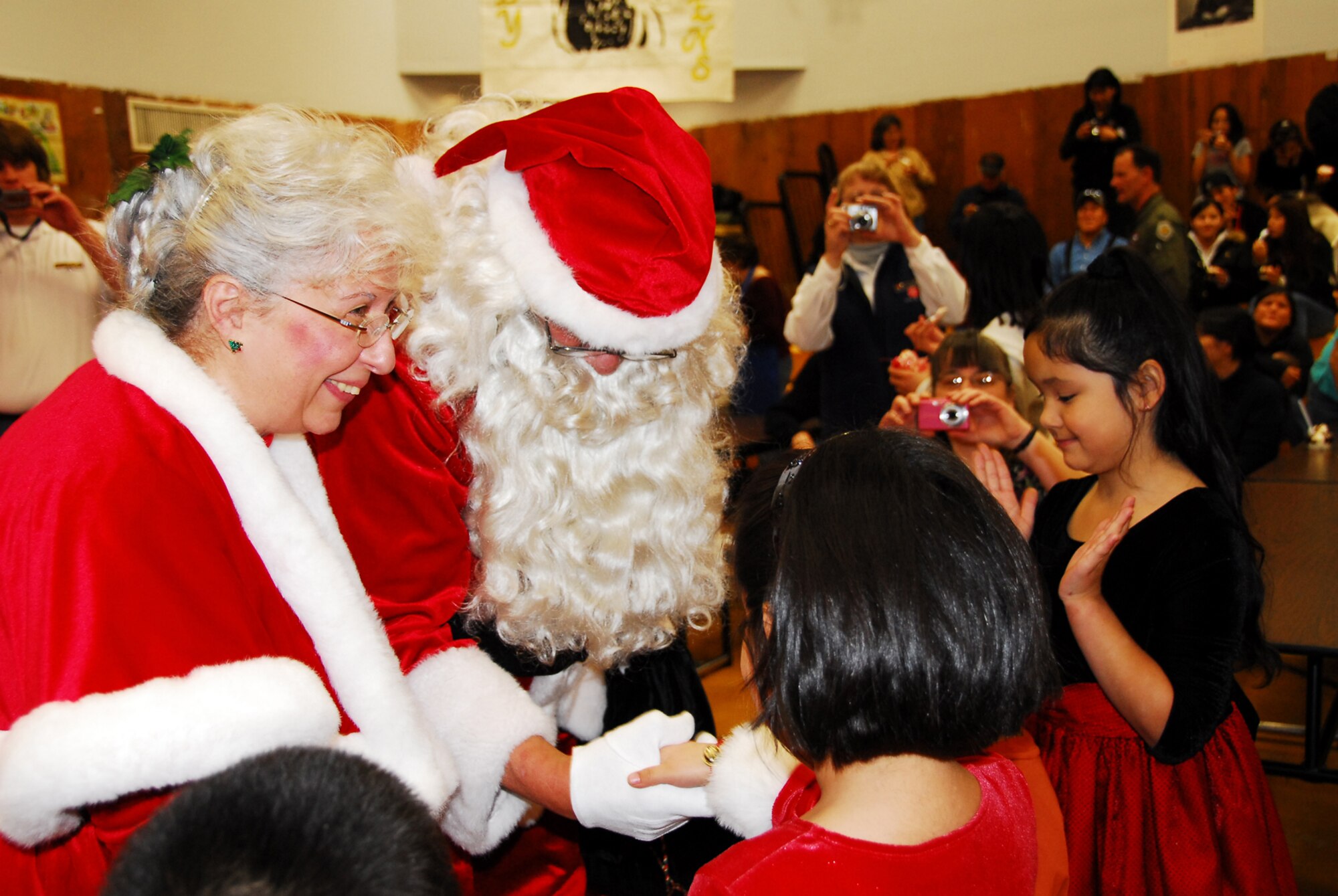 RUBY, Alaska -- Santa and Mrs. Claus meet a crowd of students in the Merreline A. Kangas School here Nov. 5. The Clauses were in town as part of the Alaska National Guard's Operation Santa Claus program. (U.S. Army photo/Kalei Brooks)