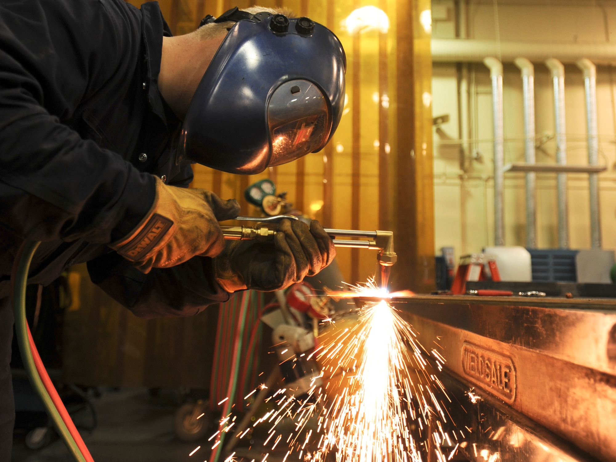 ELMENDORF AIR FORCE BASE, Alaska -- Staff Sgt. Barry Holland, 3rd Equipment Maintenance Squadron, uses an oxygen torch to cut the gusset of an aircraft stand here Nov. 5. Sergeant Holland and fellow members from the Metals Technology flight fabricate various pieces of equipment for aircraft and aerospace ground equipment. (U.S. Air Force photo/Staff Sgt. Joshua Garcia)