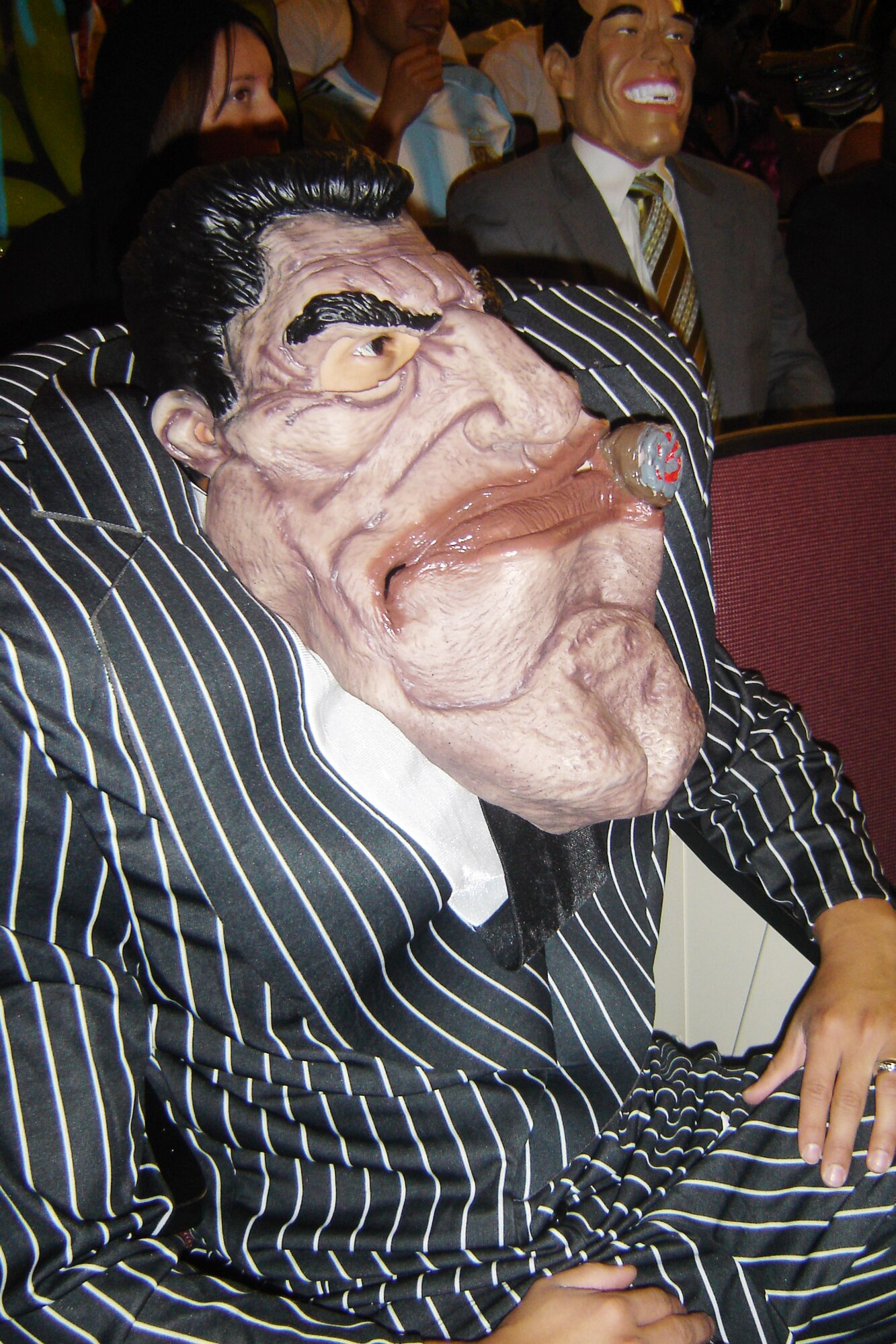 Marine Sgt. Sergio Hernandez, Recruiting Sub-Station Moreno Valley, costumes as a “Mafia guy” Nov. 30, at an RS San Diego recruiters meeting at the Cultural Resources Center at March ARB. Marines were asked by their commanders to dress up in the Halloween costume of their choice for this regular meeting at March. (U.S. Air Force photo by Will Alexander)   
