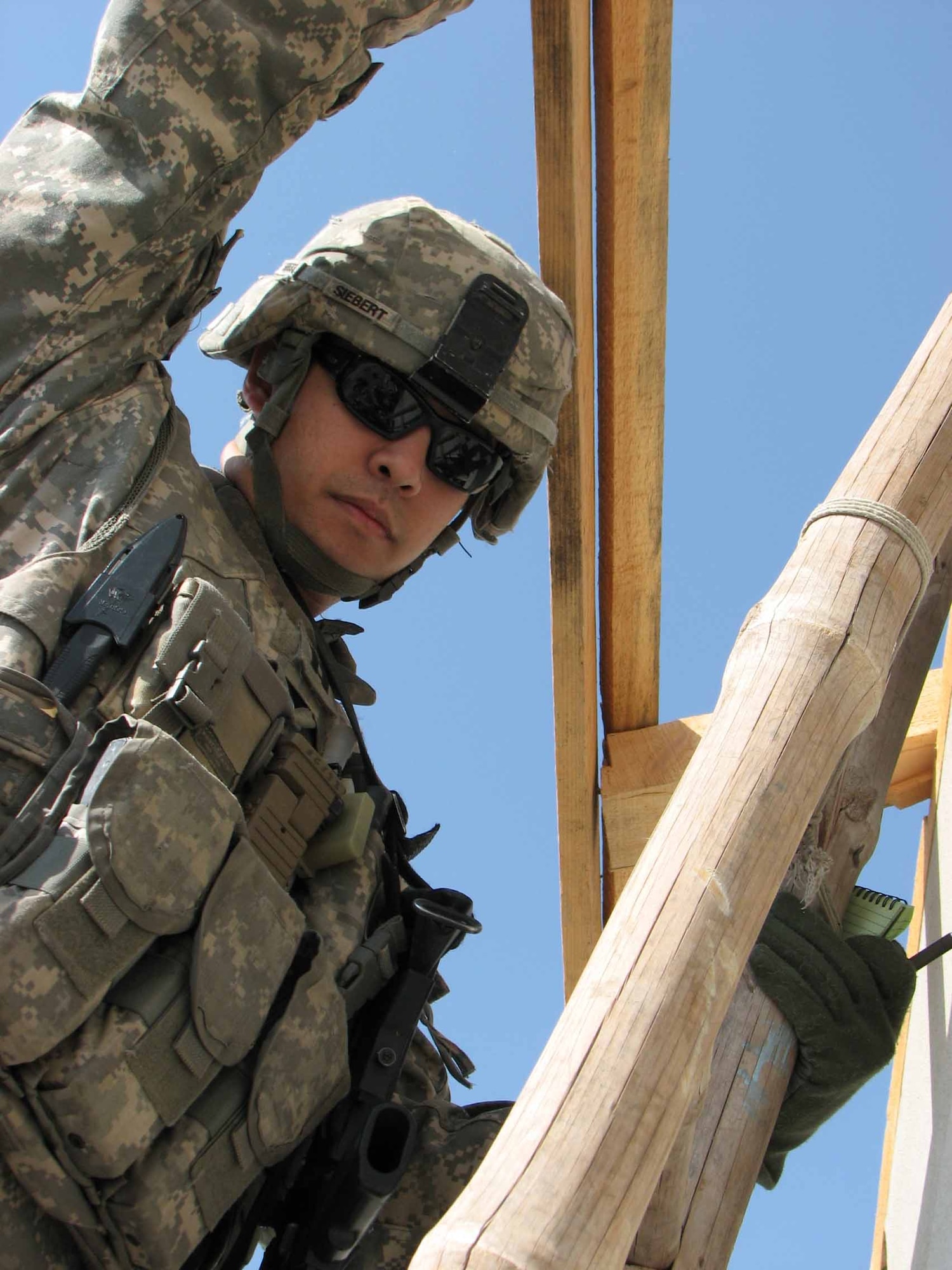 Air Force Capt. Michael Siebert, civil engineer, inspects the roof of a veterinarian clinic in Jalalabad City, Afghanistan, Nov. 3.  He is part of the Nangarhar Provincial Reconstruction Team.  The PRT is made up of Airmen and Soldiers from around the world and is charged with assisting the provincial government in improving security, governance and reconstruction.  His hometown is Mather Air Force Base, Calif. and Tacoma, Washington.  His parents are currently employed at Mildenhall Air Force Base, United Kingdom.  (U.S. Air Force photo by Capt. J. Elaine Hunnicutt/Released)