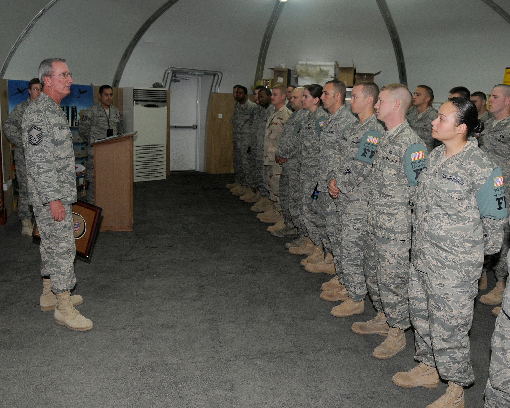 SOUTHWEST ASIA -- Senior Master Sgt. Edgar Newell, 380th Expeditionary Force Protection superintendent, addressed a formation here after they paid tribute to him at a shift change Nov. 8. Sergeant Newell is ending his last deployment prior to his retirement after nearly 40 years of military service. (U.S. Air Force photo by Tech. Sgt. Christopher A. Campbell)