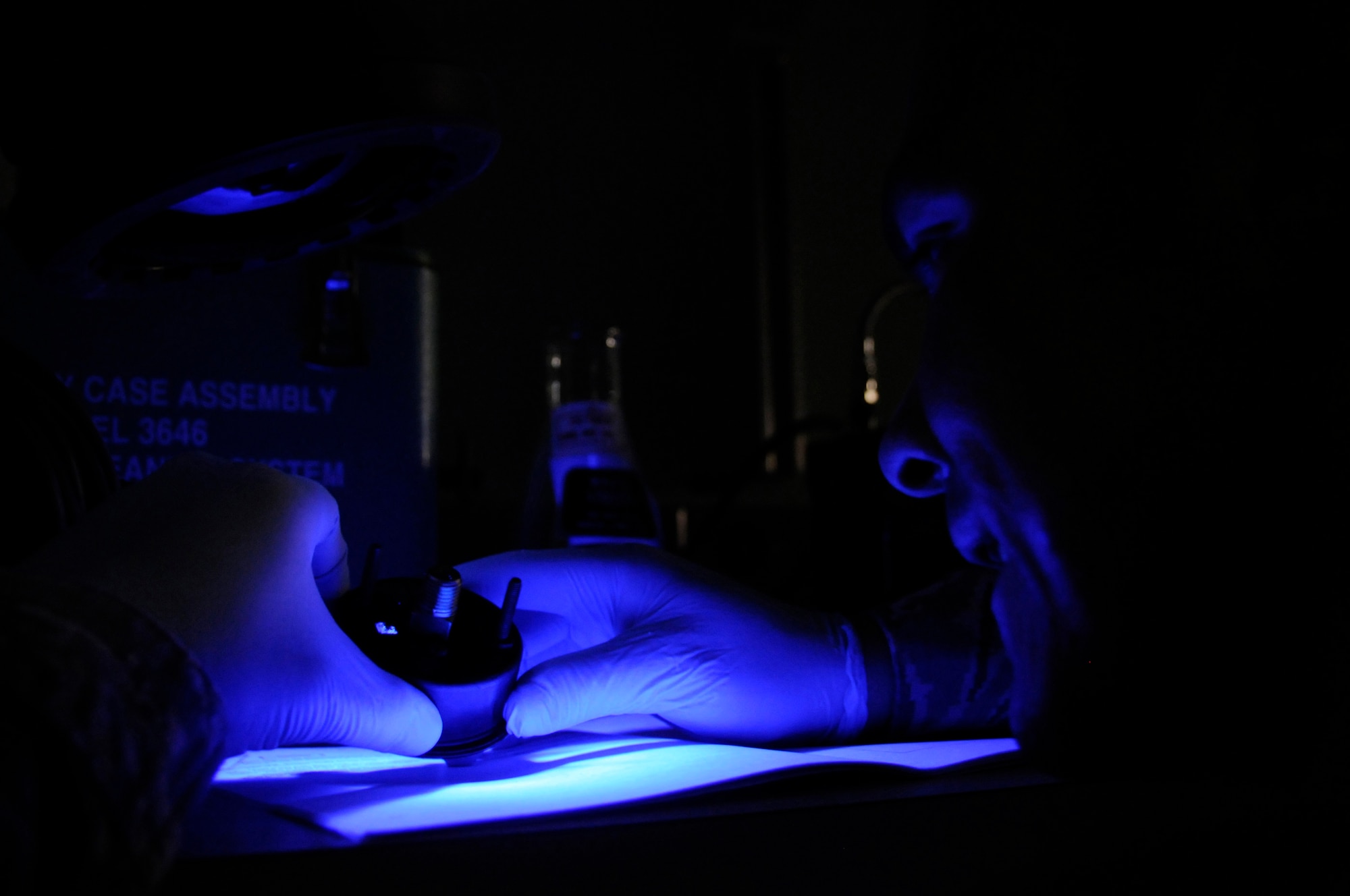 Staff Sgt. Rodney Bonham, precision measurement equipment laboratory craftsman assigned to the 379th Expeditionary Maintenance Squadron, uses an ultraviolet light to check for corrosion in an oxygen gauge Nov. 8, at an undisclosed air base in Southwest Asia.  Sergeant Bonham, a native of Tulsa, Okla., is deployed from Charleston Air Force Base, S.C., in support of Operations Iraqi and Enduring Freedom and Joint Task Force-Horn of Africa. (U.S. Air Force photo by Staff Sgt. Darnell T. Cannady/Released)