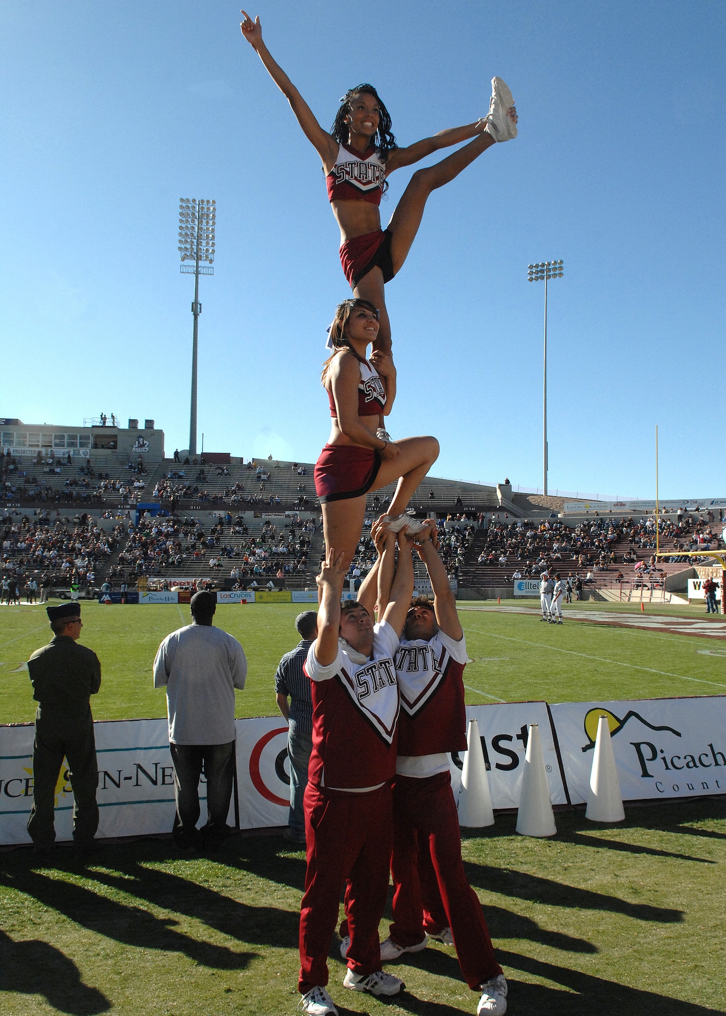 New Mexico State University cheerleaders cheer in mid air in support of the Aggies, Nov. 8, at New Mexico State University in Las Cruces, N.M.  The University of Hawaii Warriors went on to win the game 42-30. Many members of Holloman Air Force Base, N.M., attended the game. (U.S. Air Force photo by Airman 1st Class John D. Strong II)