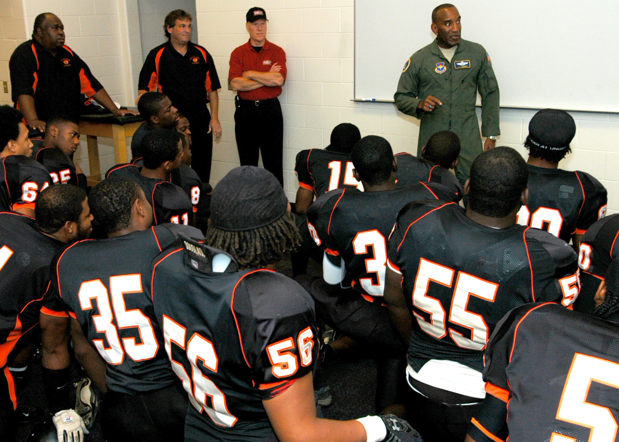 Air Force Recruiting Service Commander Brig. Gen. A.J. Stewart gives a pre-game pep talk to the Knights, Baltimore City College high school’s football team, at M&T Bank Stadium Nov. 8. The Knights were set to play its 119-year rival, the Baltimore Polytechnic Institute Engineers in the Air Force-sponsored iHigh Great American Rivalry Series. A Class of 1977 BPI alumni, General Stewart shared inspirational words with both teams before the game, and he presented one of two $500 college scholarships to to Knights player Malik Pack. (U.S. Air Force photo/Tech. Sgt. Jennifer Lindsey)