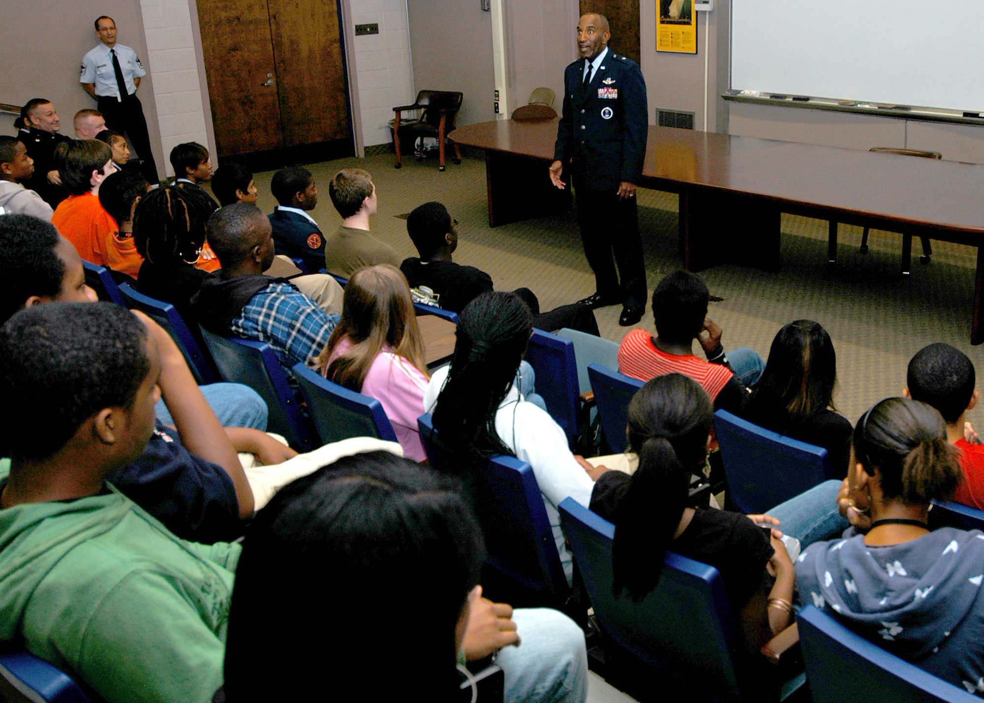 Air Force Recruiting Service Commander Brig. Gen. A.J. Stewart speaks with Baltimore Polytechnic Institute high school’s Air Force Junior ROTC students Nov. 7. A Class of 1977 BPI alumni and varsity football wide receiver, General Stewart shared his belief in the importance of education. The Engineers were set to play its 119-year rival, the Baltimore City College high school Knights in the Air Force-sponsored iHigh Great American Rivalry Series the next day. BPI won the game 16-13. (U.S. Air Force photo/Tech. Sgt. Jennifer Lindsey)