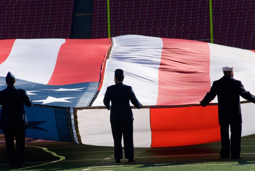 Service members from each branch welcome the New York Jets to the