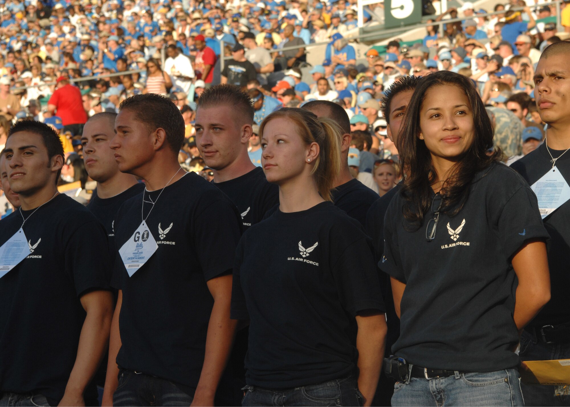 Newly sworn-in recruits are acknowledged by the public for their commitment to serve in the United States Air Force during the UCLA-Oregon State football game Nov. 8 at the Rose Bowl in Los Angeles. The event was part of the lead-up to Air Force Week-Los Angeles which kicks off Nov. 14.  The week serves as the premier platform to share the Air Force story with fellow citizens and will include community visits and talks by Air Force officials, flight demonstrations and displays providing an up close and personal look at the men and women of the Air Force serving worldwide in defense of freedom. (U.S. Air Force photo/Atiba S. Copeland).