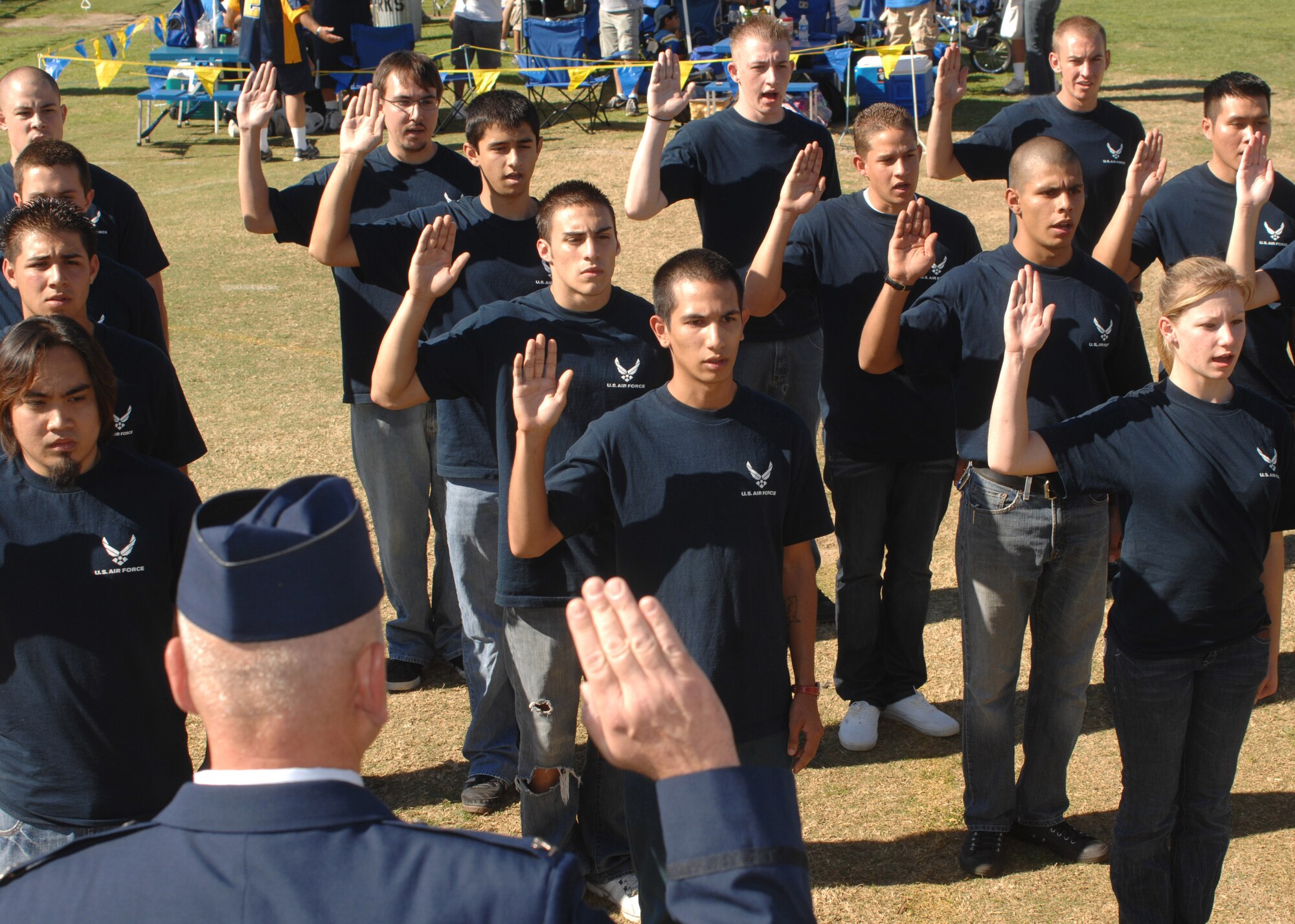 Air Force delayed enlistment participants are sworn in by Col. Jeffery Robertson prior to the start of the UCLA-Oregon State football game Nov. 8 at the Rose Bowl in Los Angeles.  The event was part of the lead-up to Air Force Week-Los Angeles which kicks off Nov. 14.  The week serves as the premier platform to share the Air Force story with fellow citizens and will include community visits and talks by Air Force officials, flight demonstrations and displays providing an up close and personal look at the men and women of the Air Force serving worldwide in defense of freedom. (U.S. Air Force photo/Atiba S. Copeland).