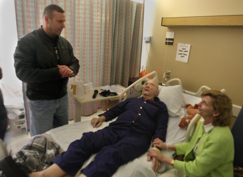 LAKE CITY, Fla. -- Col. Henry Santicola, 23rd Wing vice commander, Moody Air Force Base, Ga., visits with Korean and Vietnam war-era veteran Bobby Johnson and his wife at the Veterans Administration hospital on Nov. 8.  The visit was part of the Poppa Joe's 2nd Annual Books for Vets motorcycle ride presented by the American Leagion Riders Post 13, Valdosta, Ga.  More than 90 motorcyclists completed the ride from Valdosta to Lake City safely and donated 1,212 books. (U.S. Air Force photo by Master Sgt. Michael Featherston)