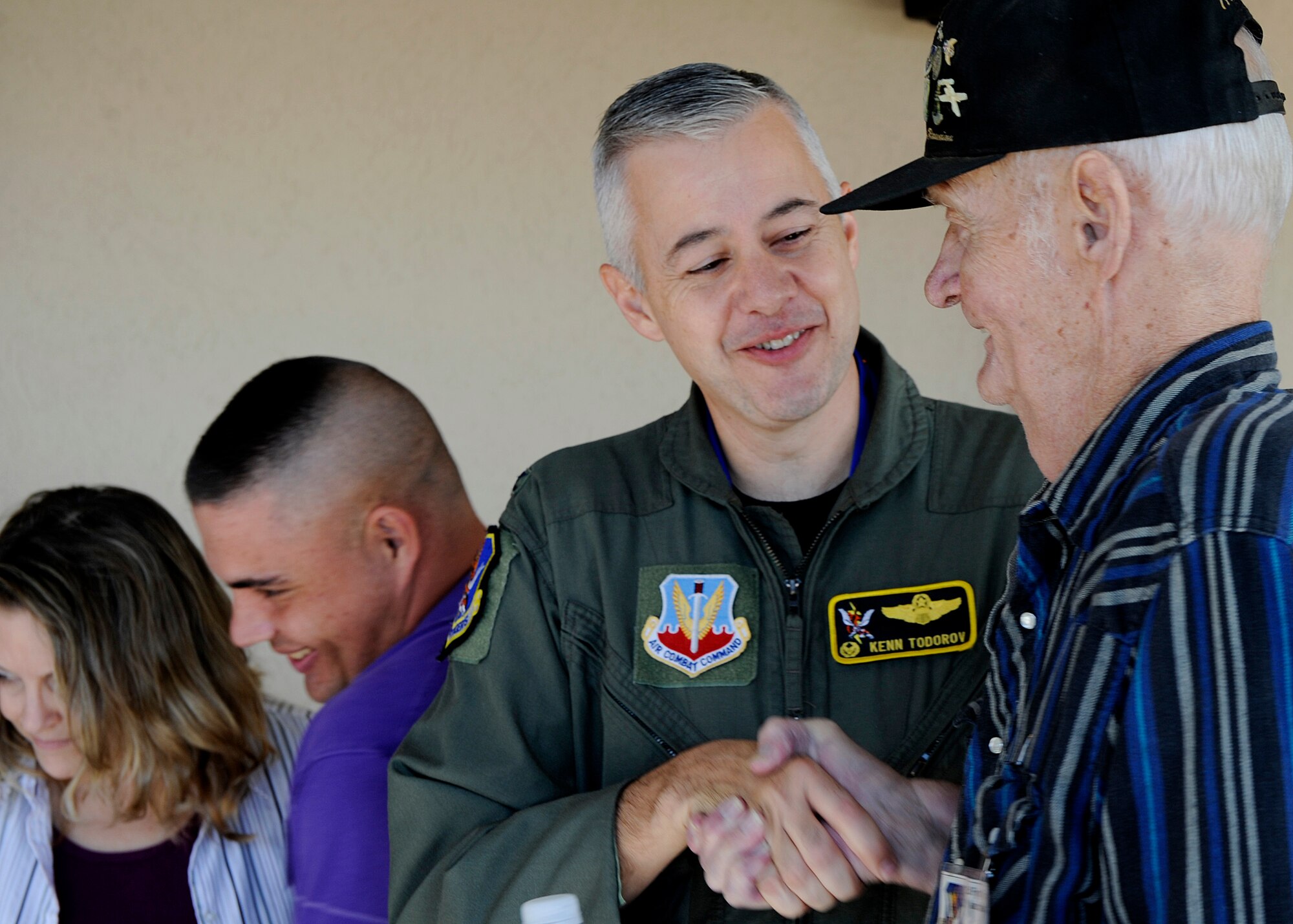 MOODY AIR FORCE BASE, Ga. – Col. Kenneth Todorov, 23rd Wing commander, shakes the hand of a member of the Flying Tiger Reunion here Nov. 7. The veterans attended a building naming ceremony. (U.S. Air Force photo by Senior Airman Brittany Barker) 
