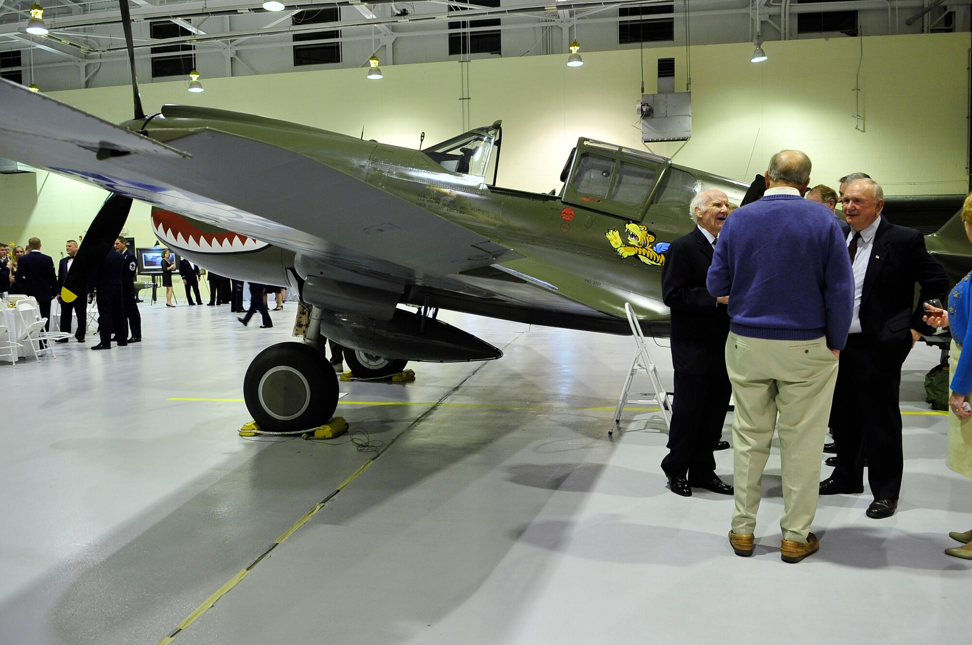 MOODY AIR FORCE BASE, Ga. – Former Flying Tiger members chat in front of a P-40 Warhawk fighter plane during the 2008 Flying Tiger Association Reunion here Nov 8. This P-40 was the aircraft used during World War II by the Flying Tigers. (U.S. Air Force photo by Senior Airman Elizabeth Rissmiller)

