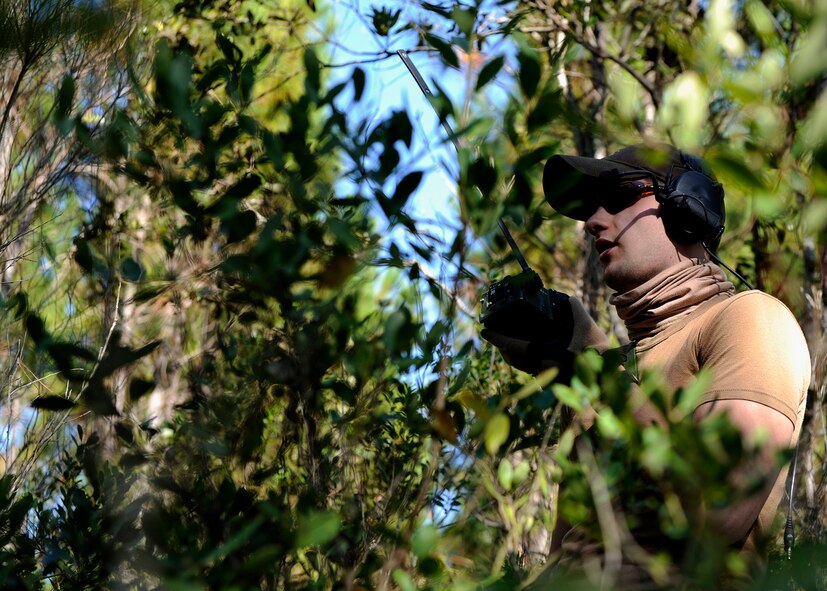 MOODY AIR FORCE BASE, Ga. -- During a week-long deployment training exercise, the 41st Rescue Squadron performed a variety of sorties including recovering injured pilots whose aircraft had gone down here Nov. 6. An Airman of the 41st RQS simulates a downed pilot in a hostile area calling for help. (U.S. Air Force photo by Senior Airman Brittany Barker)
