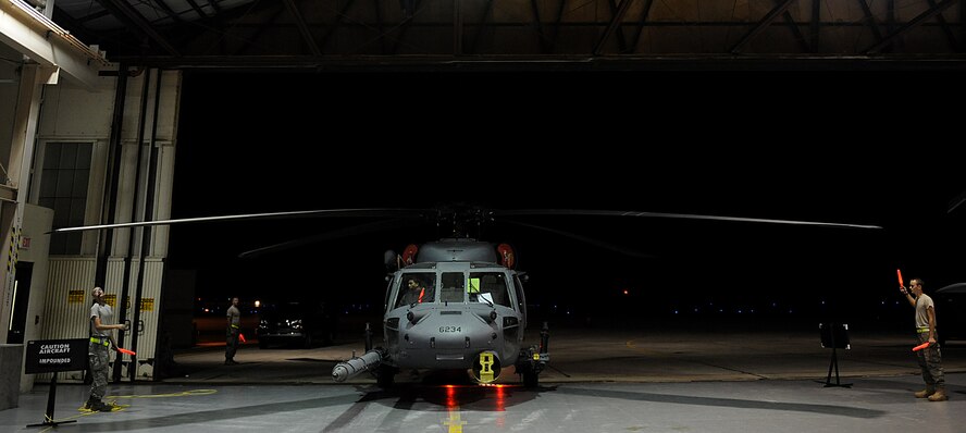 MOODY AIR FORCE BASE, Ga. – Members of the 723rd Aircraft Maintenance Squadron marshal an HH-60G Pave Hawk while it was being towed here Nov. 6. Maintainers and aircrew of the HH-60G Pave Hawk are in a war week, which is a week-long exercise of pre-deployment training. (U.S. Air Force photo by Senior Airman Gina Chiaverotti)